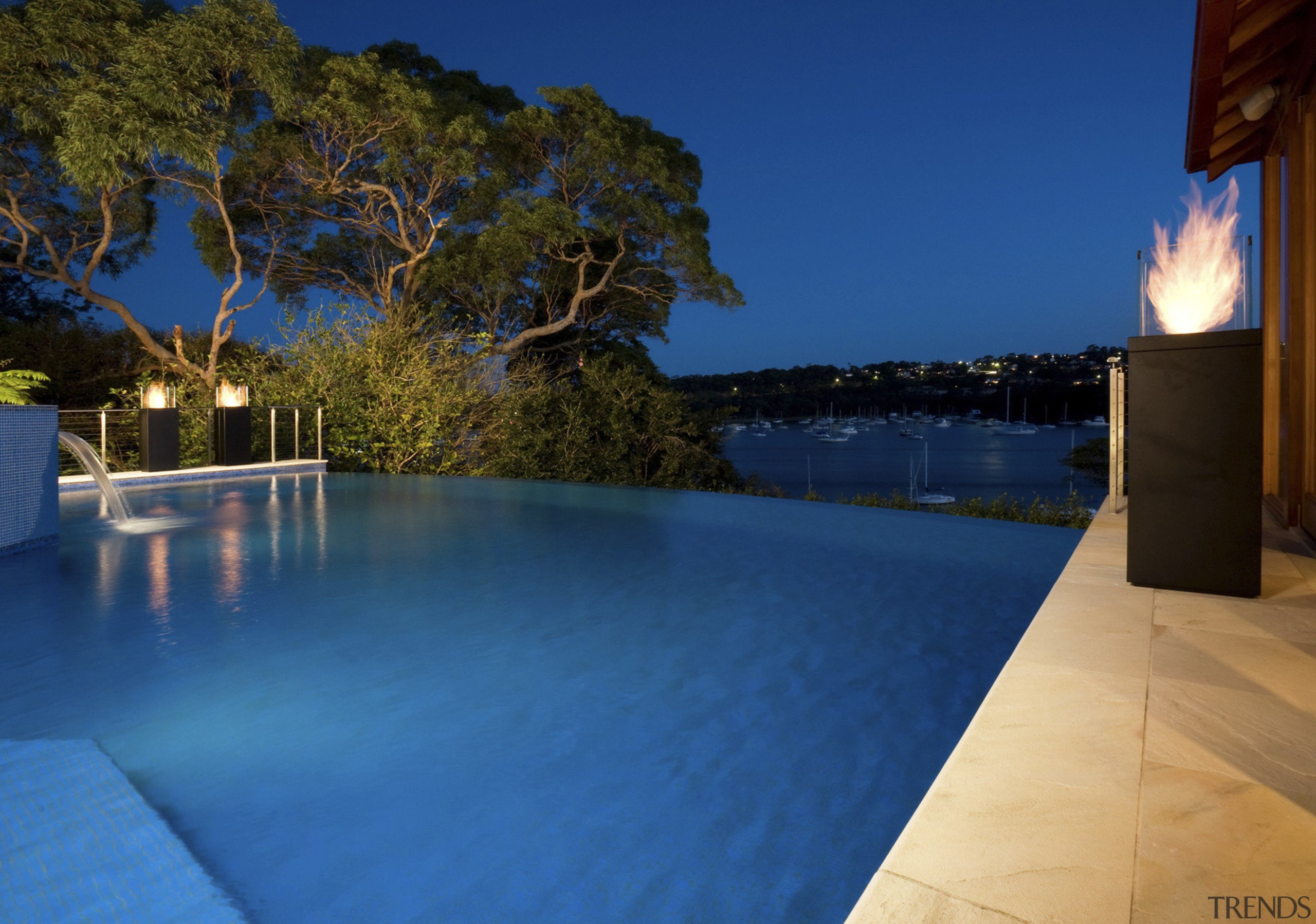 View of new EcoSmart Fire Tower from Real blue, estate, leisure, lighting, property, real estate, reflection, resort, sky, swimming pool, vacation, villa, water, blue