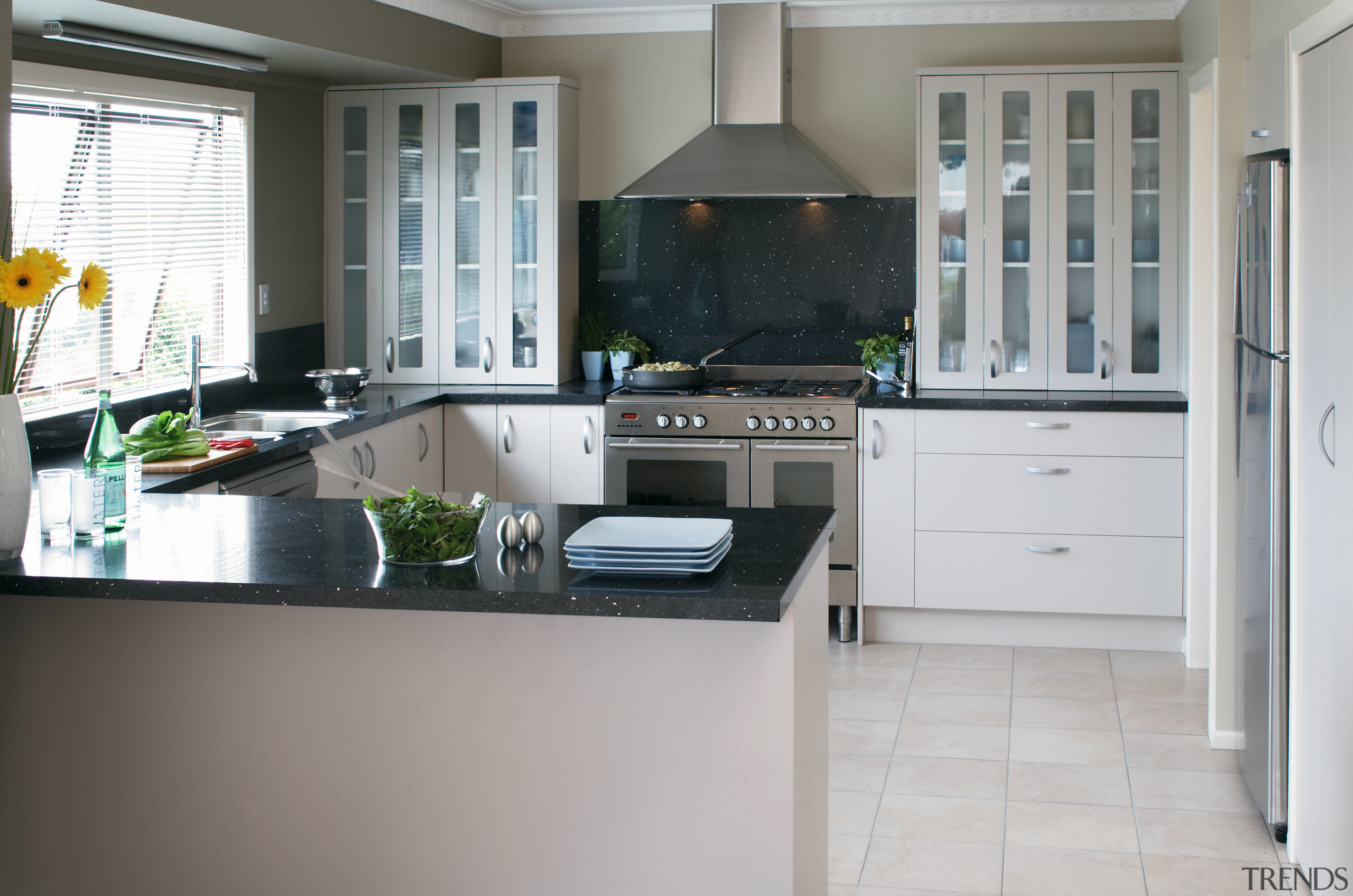 A view of this newly renovated kitchen design countertop, cuisine classique, floor, flooring, interior design, kitchen, real estate, room, gray