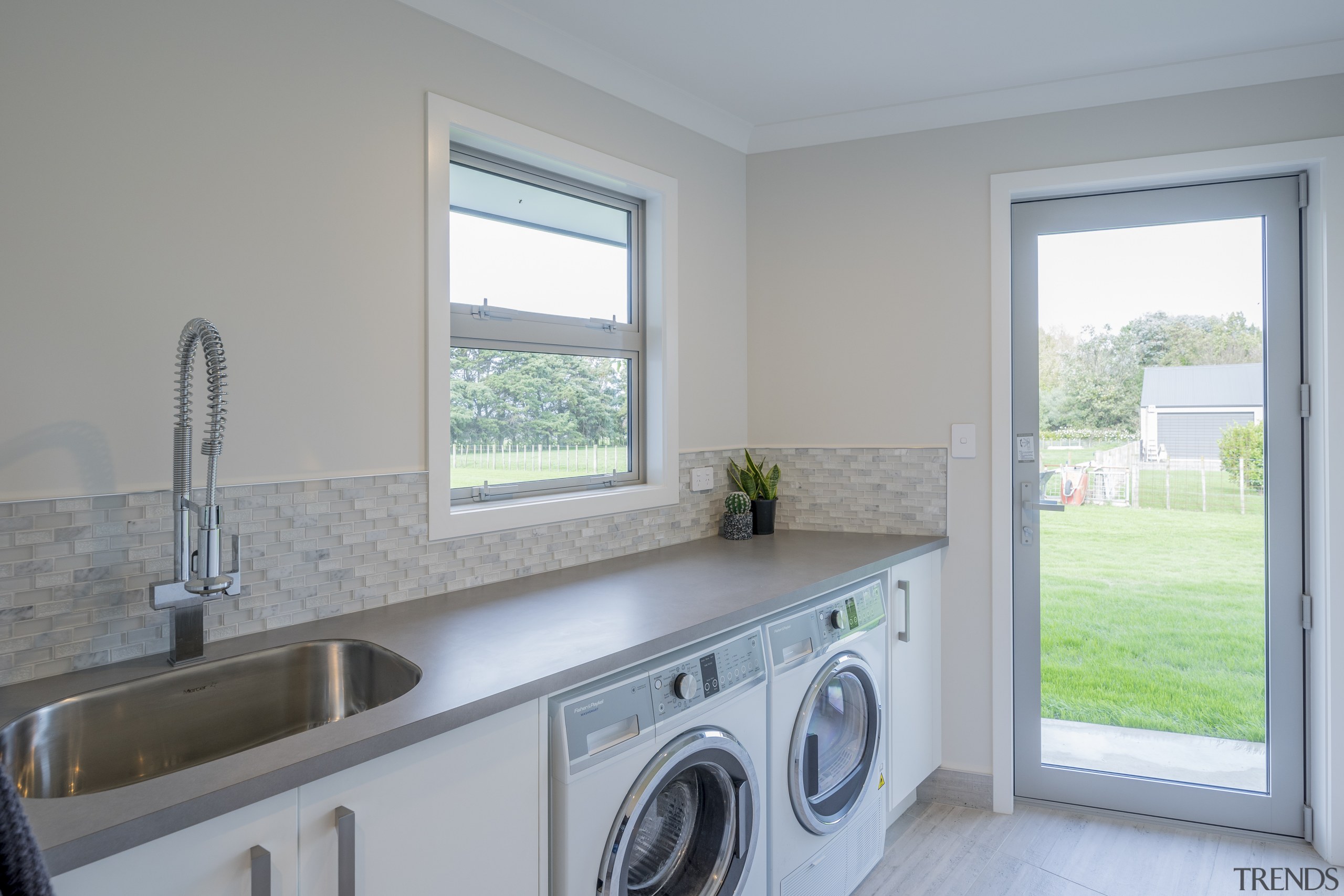 Award-winning home offers intelligent layouts and refined finishes home, laundry, laundry room, property, real estate, room, window, gray