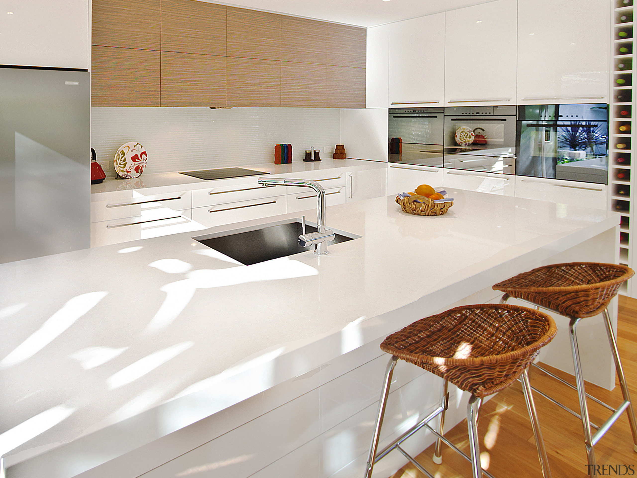 View of kitchen featuring wood floors, white bench countertop, cuisine classique, floor, flooring, interior design, kitchen, laminate flooring, table, tile, wood flooring, white