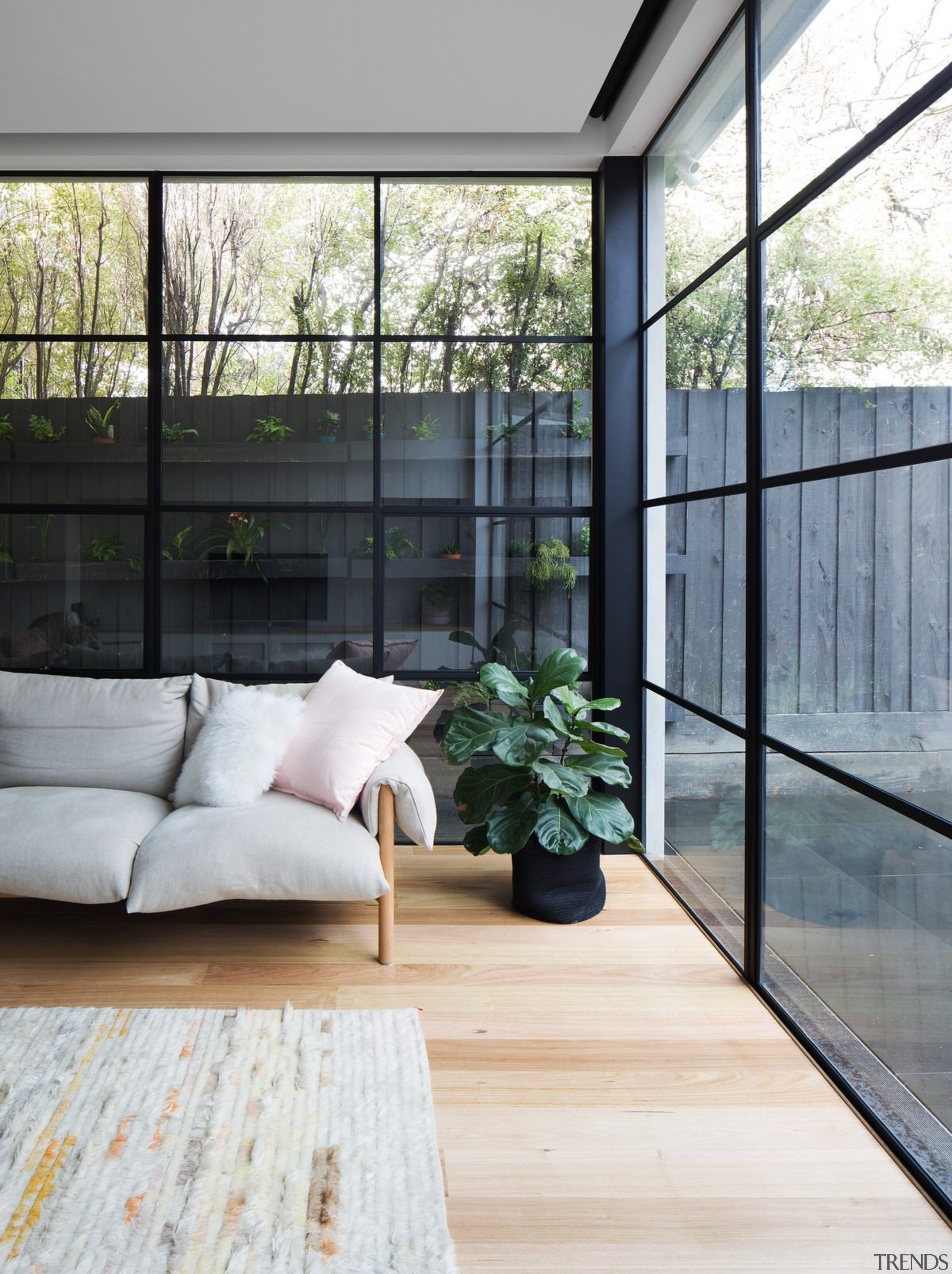 The living room looks out to the yard architecture, daylighting, door, floor, flooring, hardwood, home, house, interior design, living room, window, wood, wood flooring, gray, white