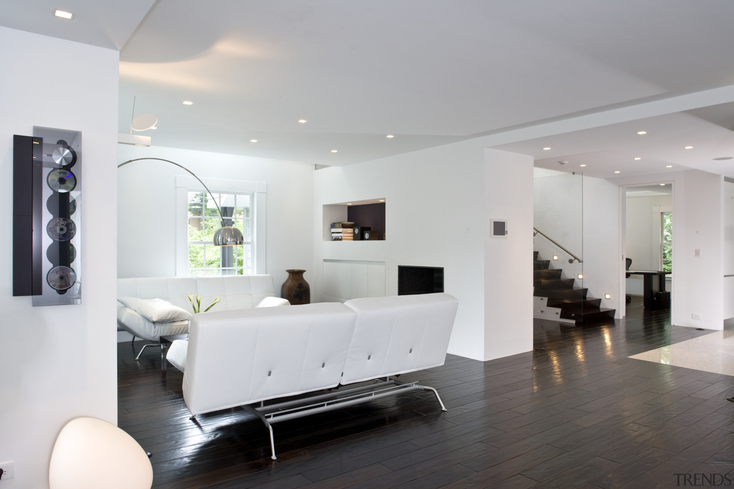 A shot of the white painted contemporary minimalist ceiling, floor, flooring, home, house, interior design, living room, product design, real estate, room, gray