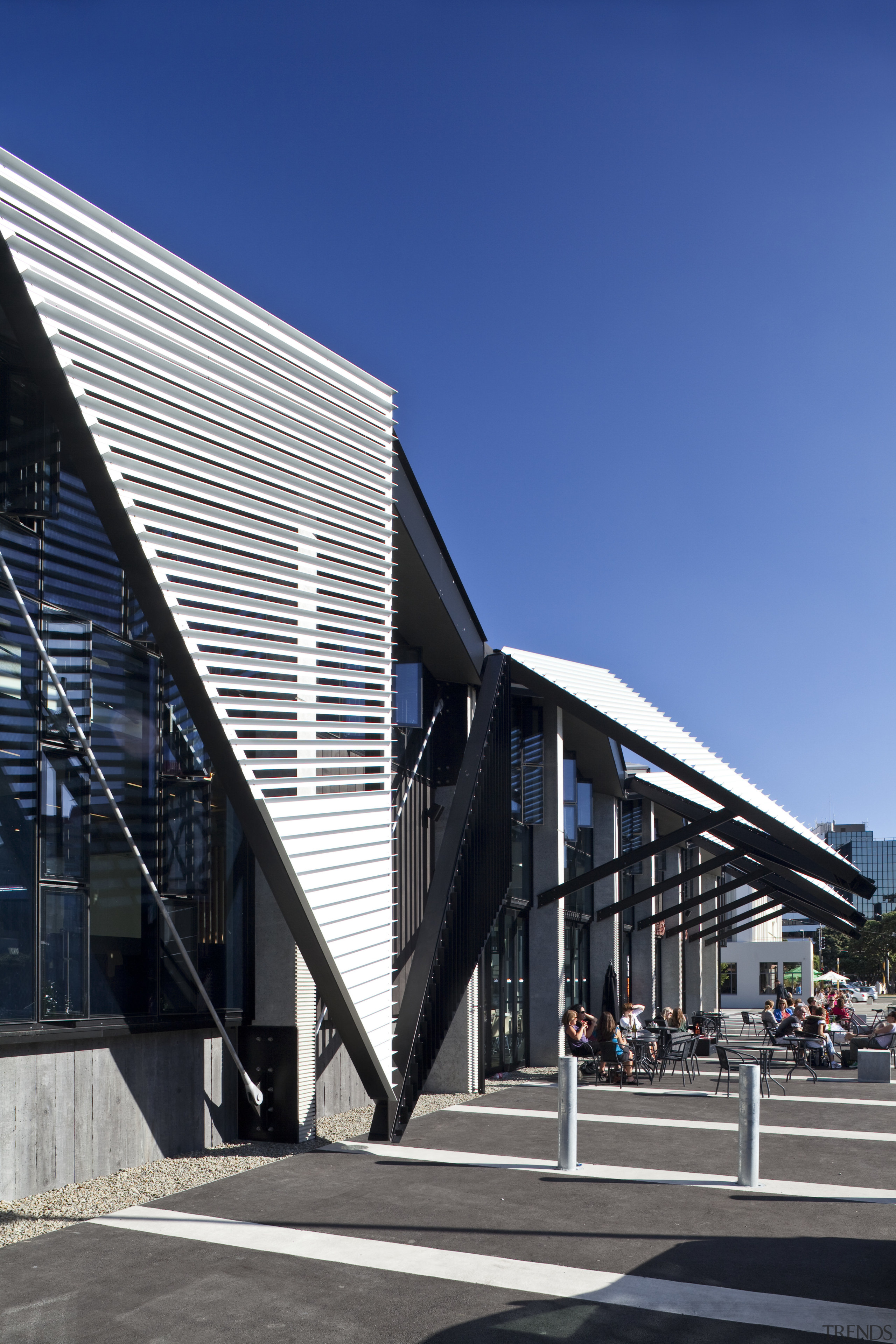 View of folded roof and canopy design at architecture, building, commercial building, corporate headquarters, daylighting, daytime, facade, headquarters, house, mixed use, sky, structure, blue, black