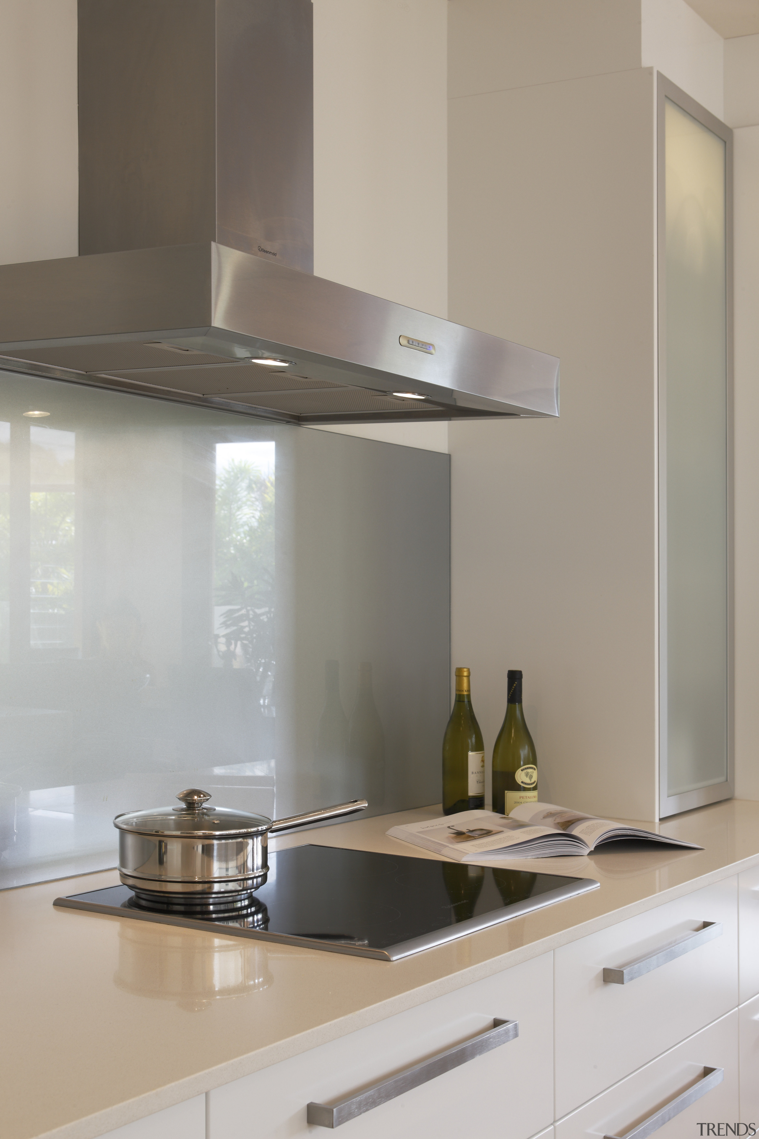 The commercial-grade rangehood features a powerful extractor fan cabinetry, countertop, cuisine classique, exhaust hood, glass, home appliance, interior design, kitchen, kitchen appliance, kitchen stove, light fixture, product design, tap, under cabinet lighting, gray