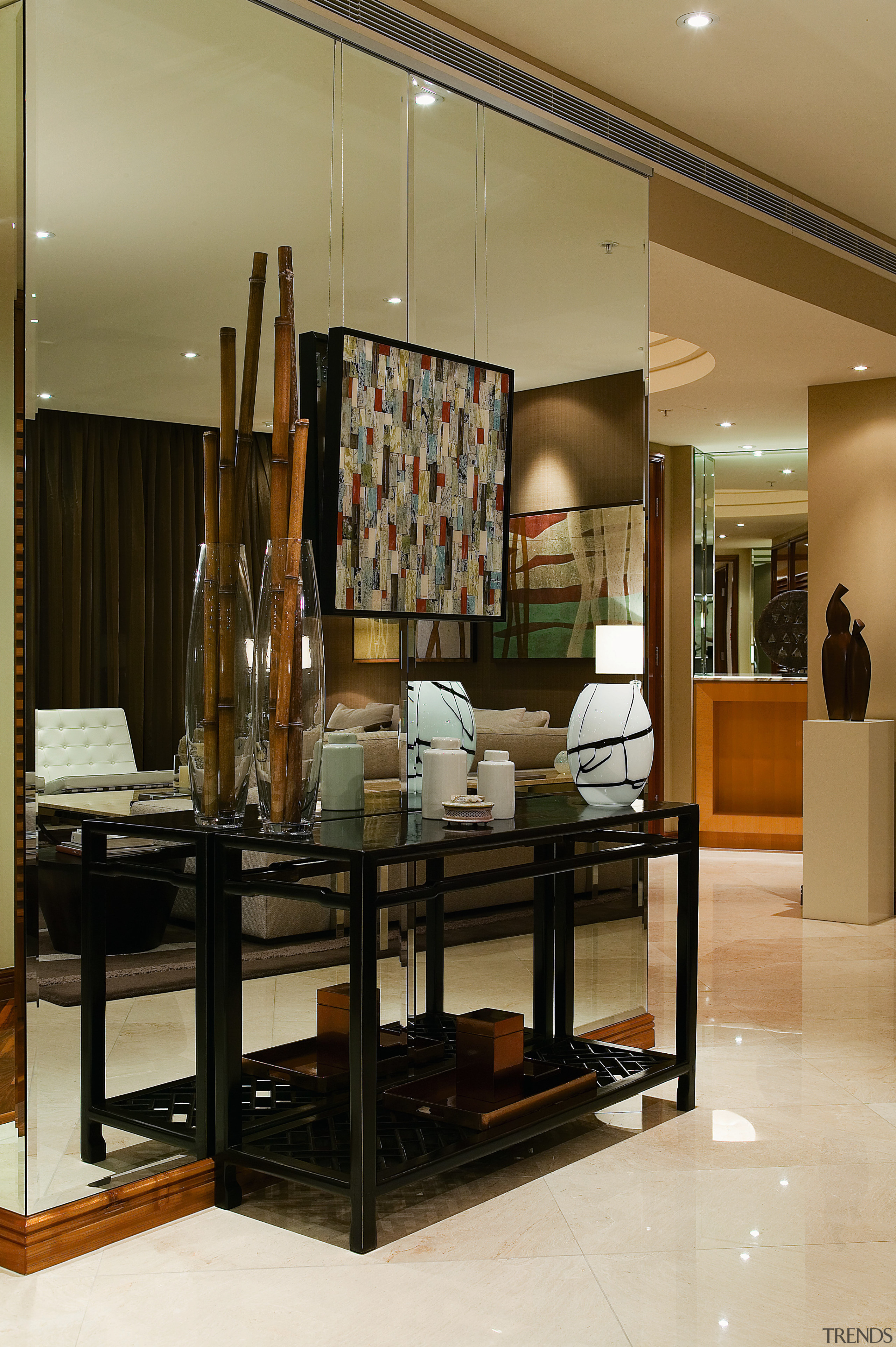 view of the cabinet, mirrored wall, ornaments - flooring, furniture, interior design, table, brown