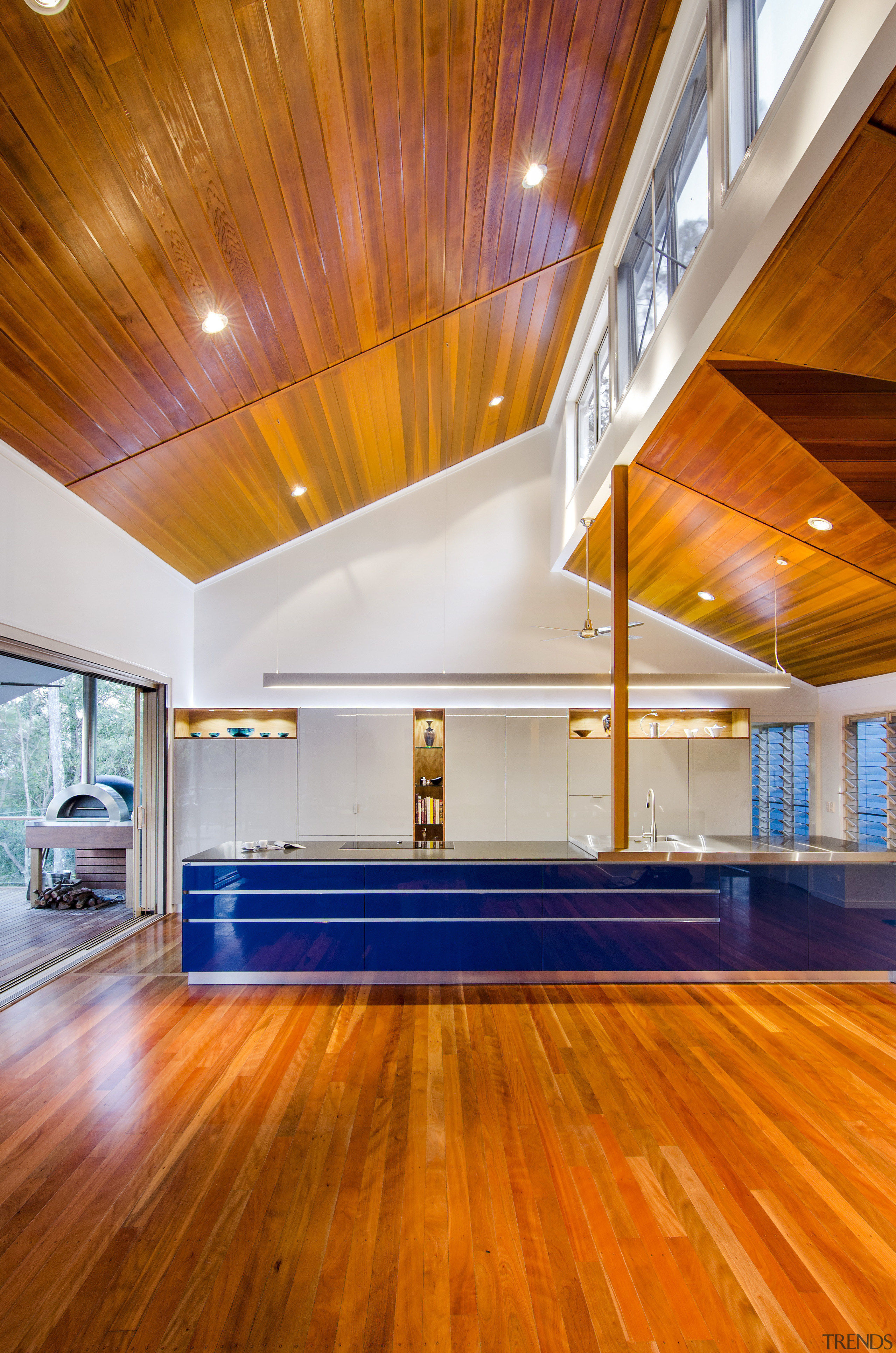 This kitchen was designed by Kim Duffin of apartment, architecture, ceiling, daylighting, floor, flooring, hardwood, home, house, interior design, laminate flooring, light, lighting, lobby, real estate, room, wall, wood, wood flooring, orange