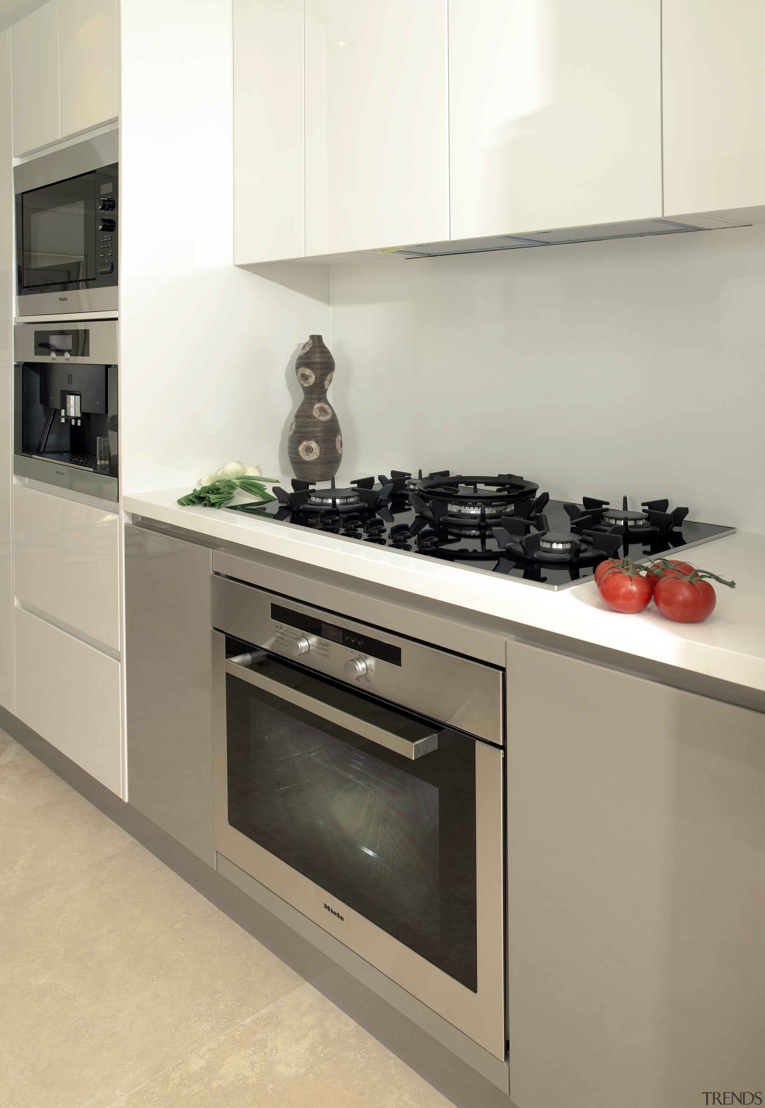 Kitchens are equipped with Miele  aplliances, which countertop, home appliance, interior design, kitchen, kitchen appliance, kitchen stove, major appliance, oven, gray, white