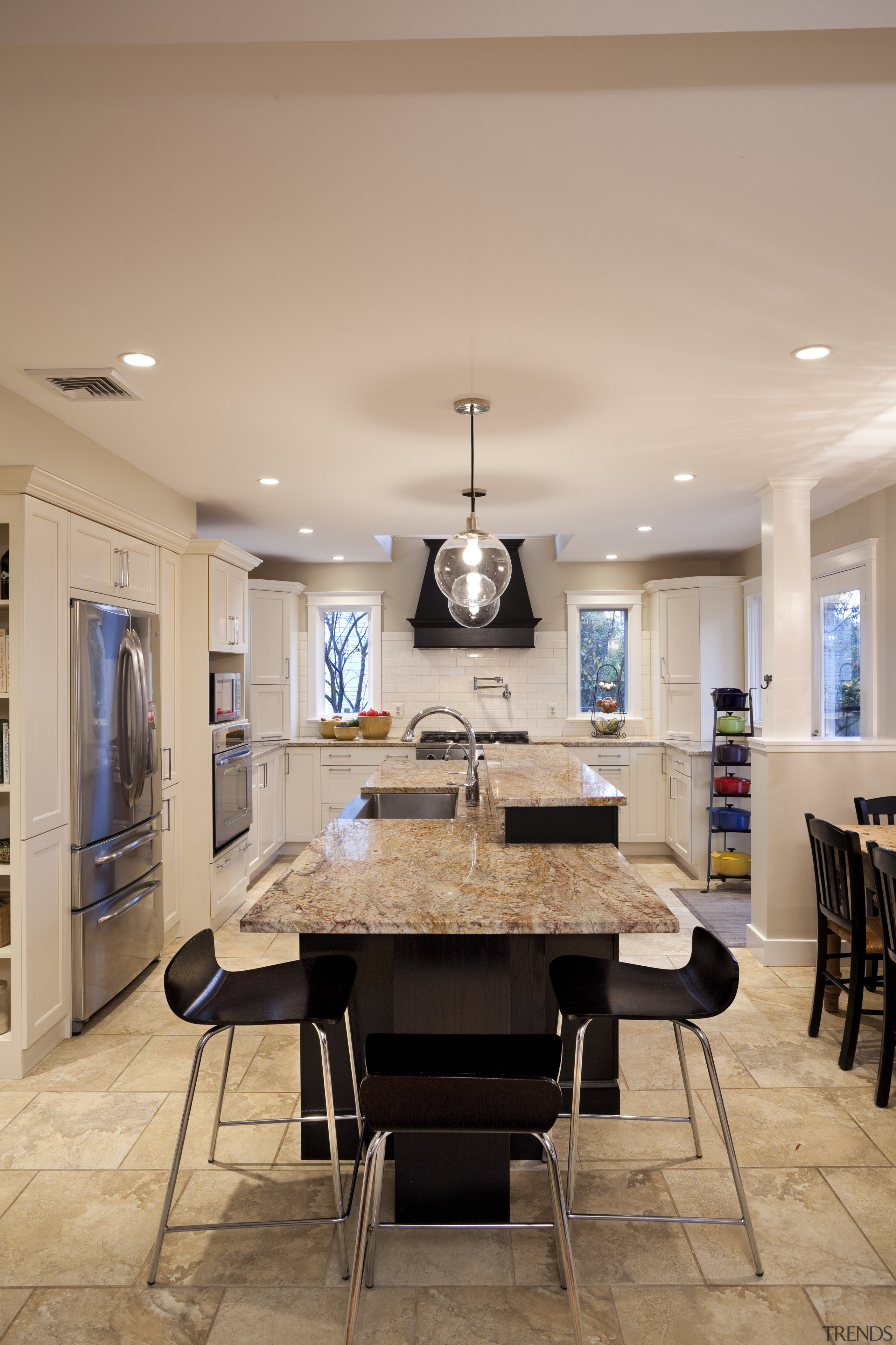 This kitchen was designed by Nadia Subaran of ceiling, dining room, furniture, interior design, kitchen, living room, room, table, orange