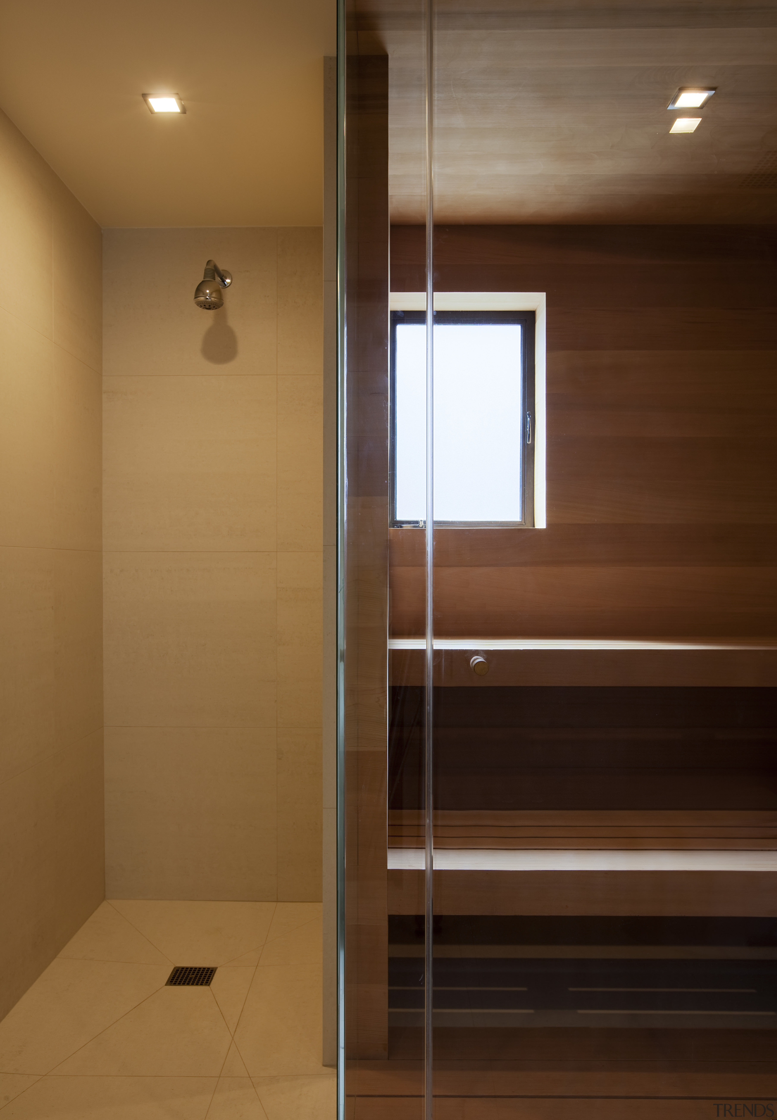 Shower with wooden seats next to it. - architecture, bathroom, ceiling, daylighting, floor, flooring, hardwood, interior design, light, light fixture, lighting, room, wall, wood, brown