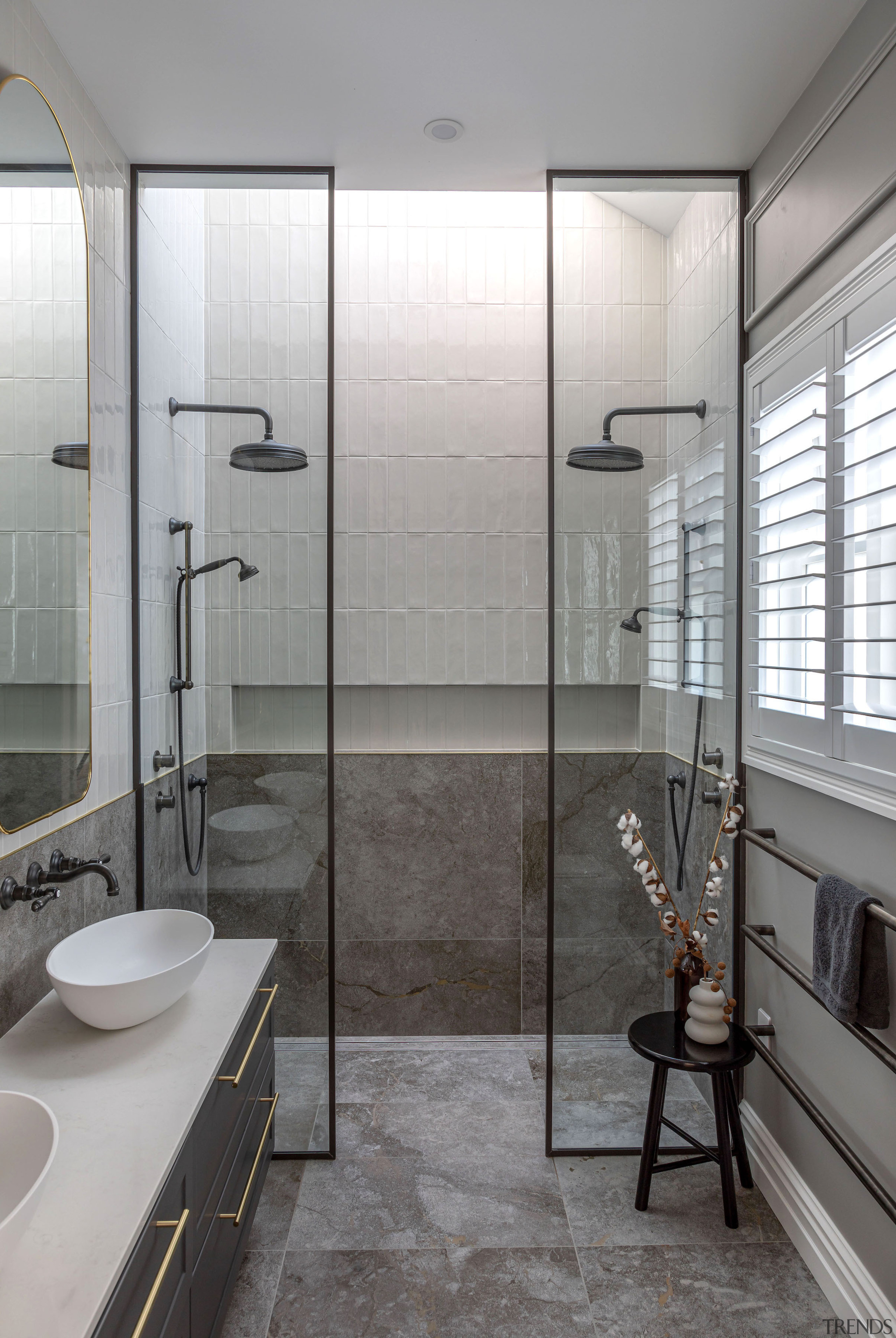 Master ensuite with traditional-look rainhead shower heads. 