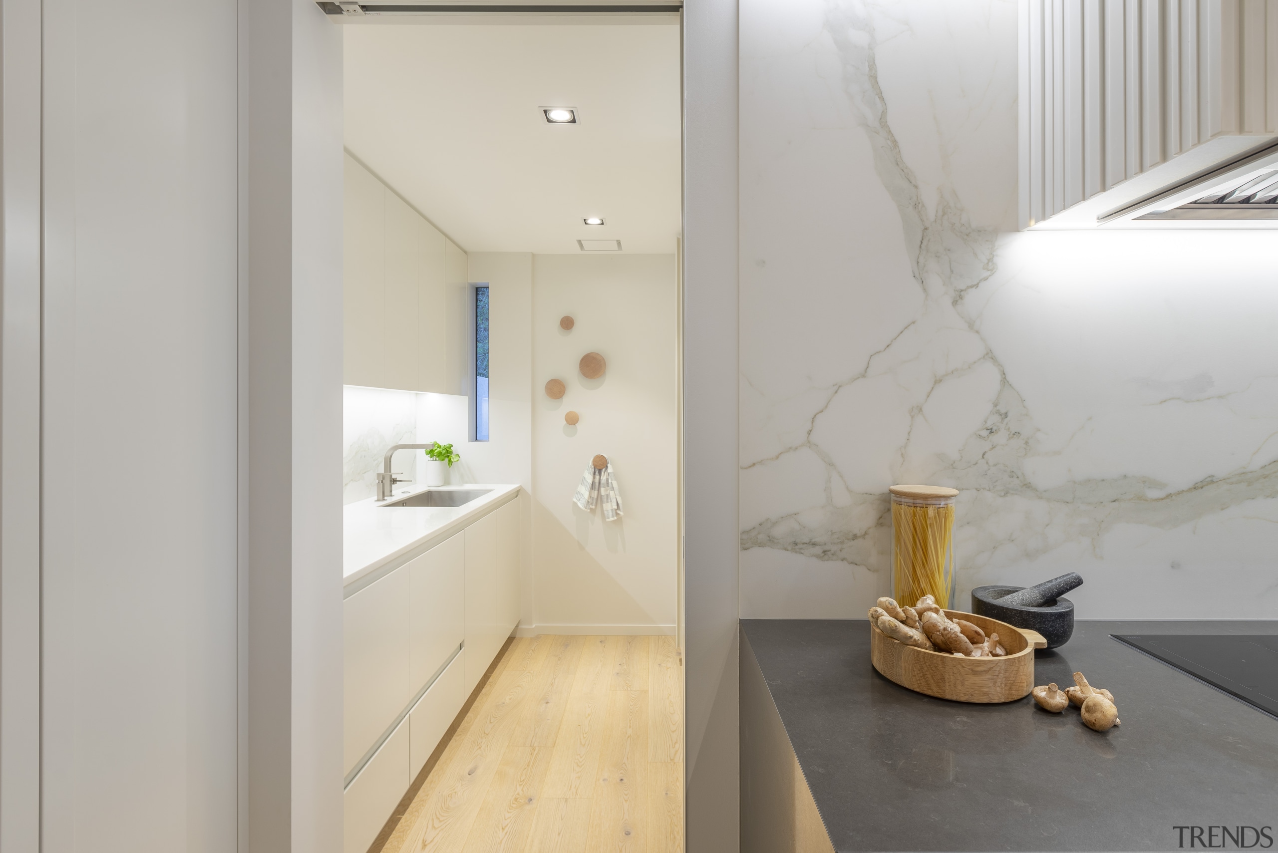 An adjoining bathroom behind the kitchen was reconfigured architecture, beige, building, ceiling, design, floor, flooring, furniture, home, house, interior design, loft, material property, property, real estate, room, tile, wall, gray