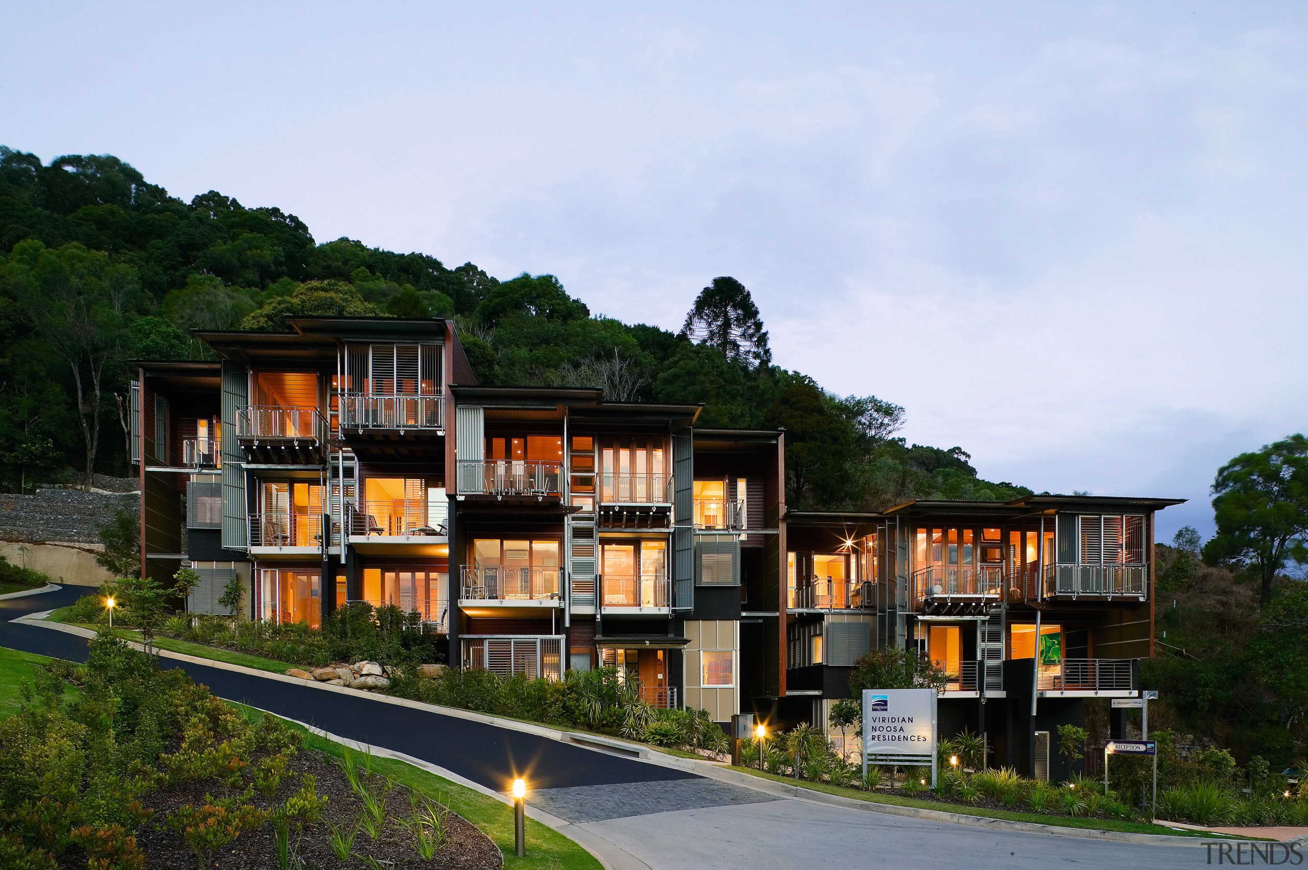 Exterior view of this new apartment block  architecture, building, condominium, cottage, estate, home, house, mixed use, property, real estate, residential area, sky, villa, teal