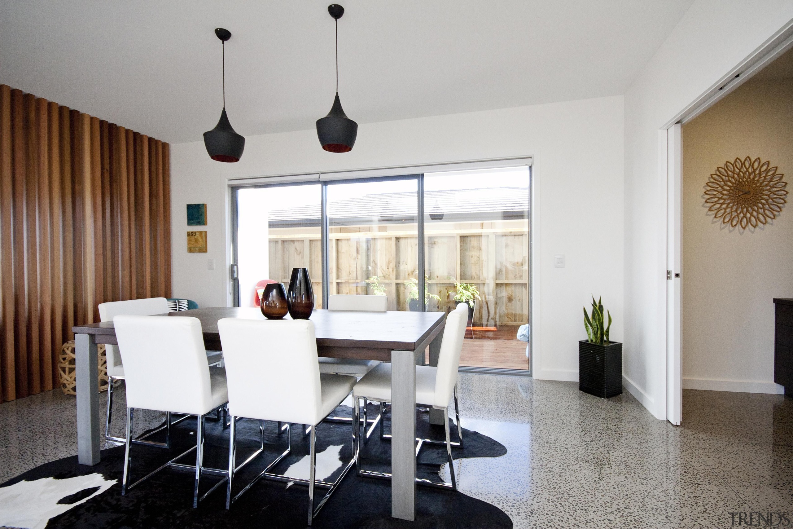 Dining room with polished concrete floor in a apartment, chair, dining room, furniture, interior design, living room, property, real estate, room, table, gray