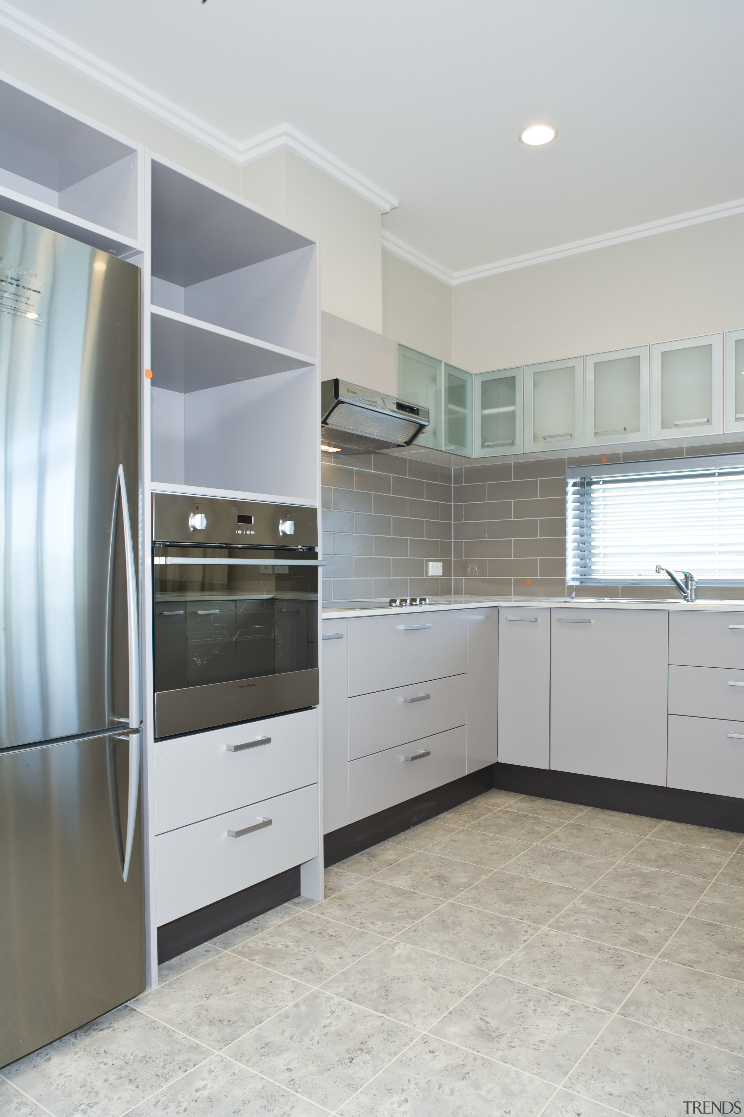 View of a kitchen area at Summerset by cabinetry, countertop, floor, home appliance, interior design, kitchen, real estate, room, gray