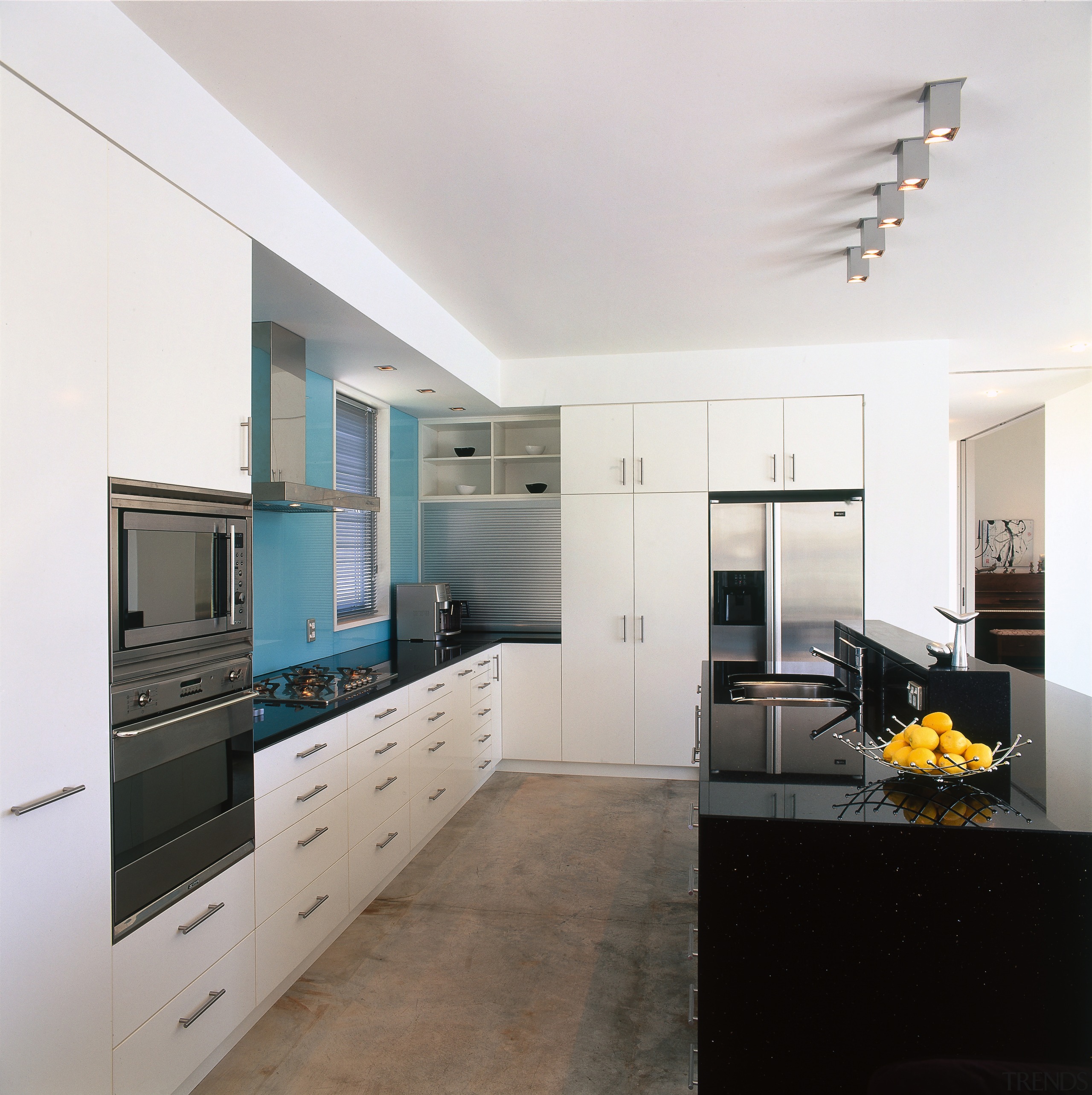 A view of the kitchen area, concrete flooring, cabinetry, countertop, interior design, kitchen, real estate, room, white