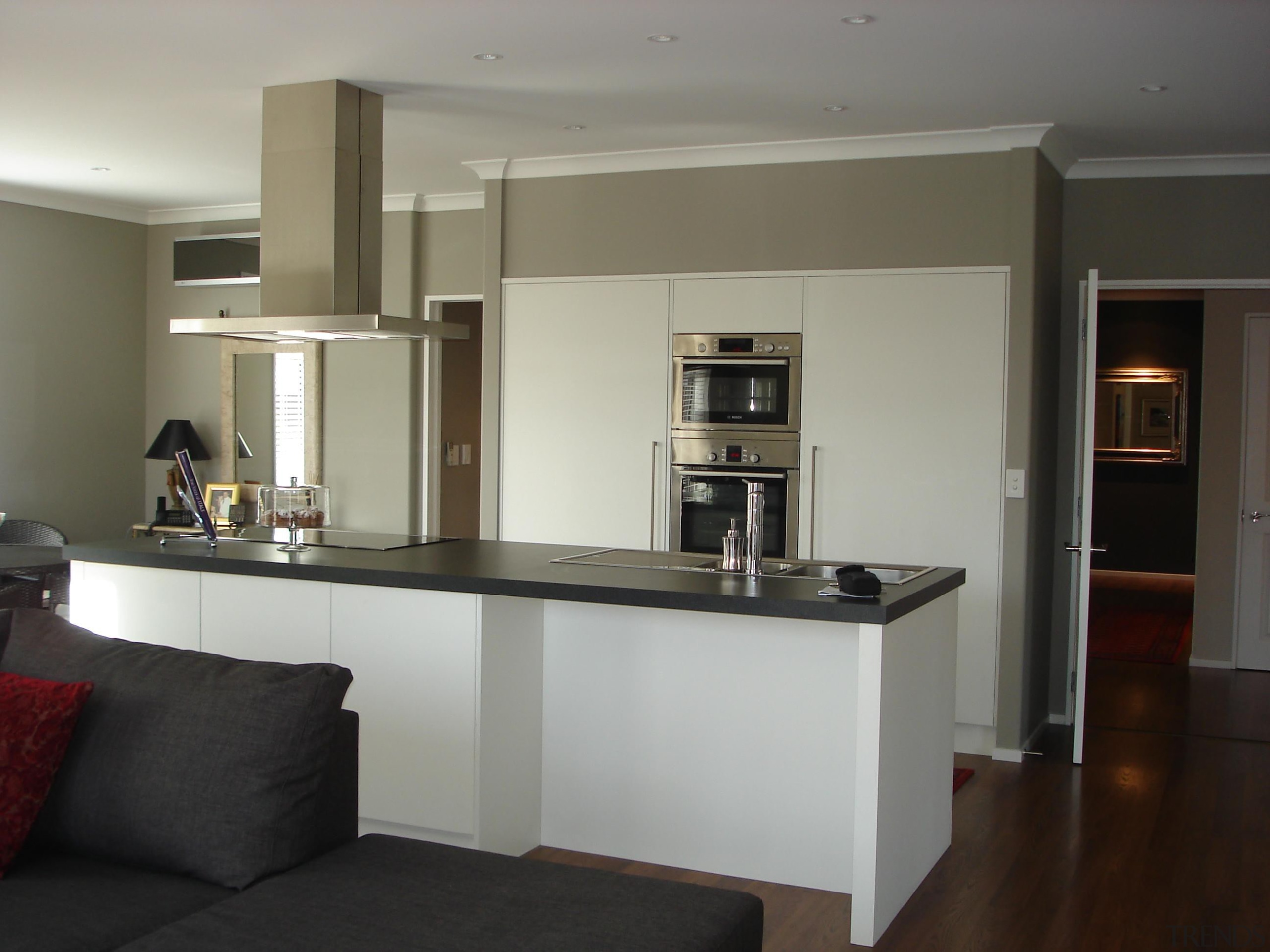 Open plan kitchen and living roomFor more information, countertop, interior design, kitchen, room, gray, black