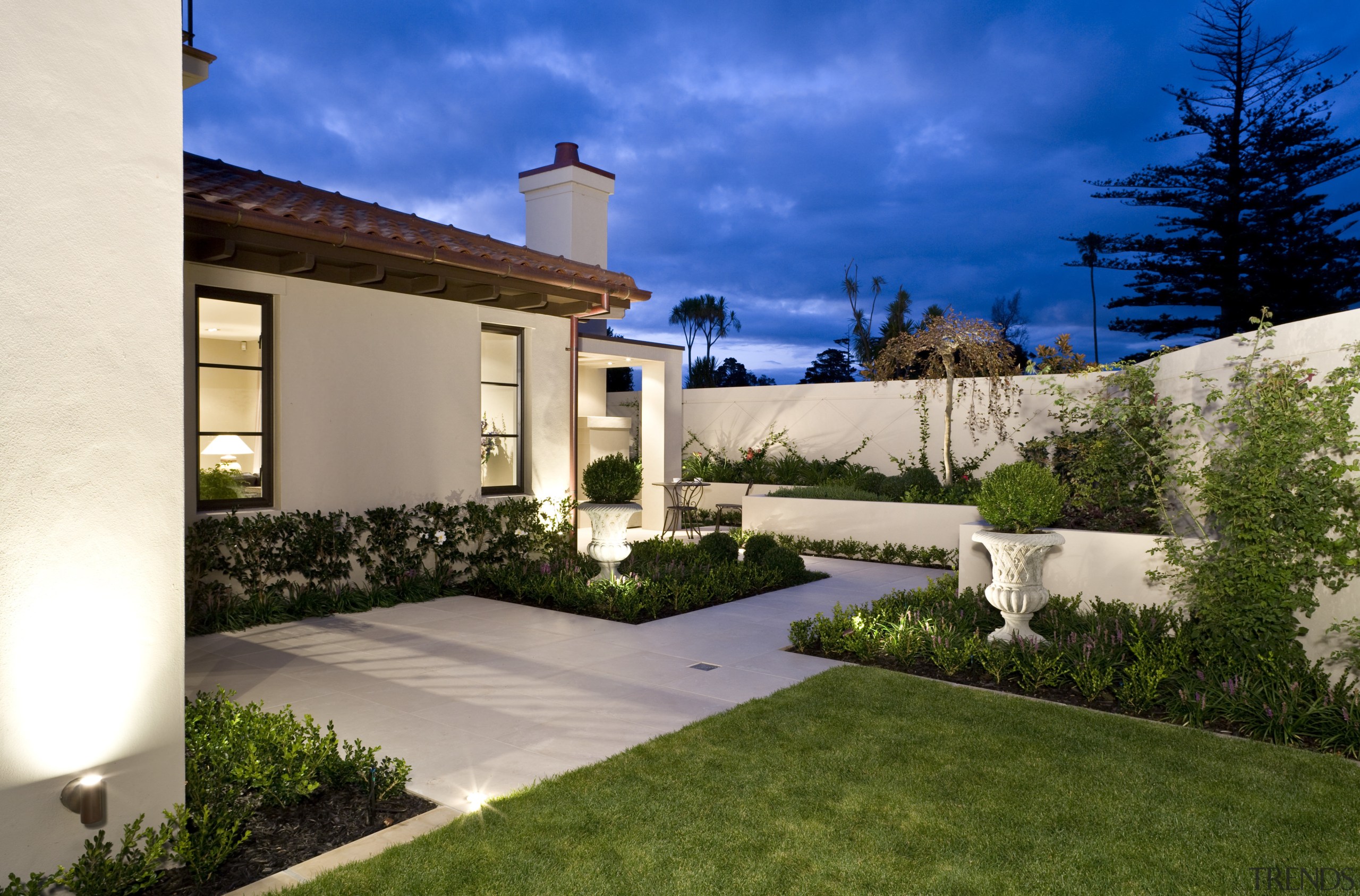 Exterior view of a Mediterranean-style house built by architecture, backyard, estate, facade, grass, home, house, landscape, landscaping, lighting, mansion, property, real estate, residential area, villa, yard, brown