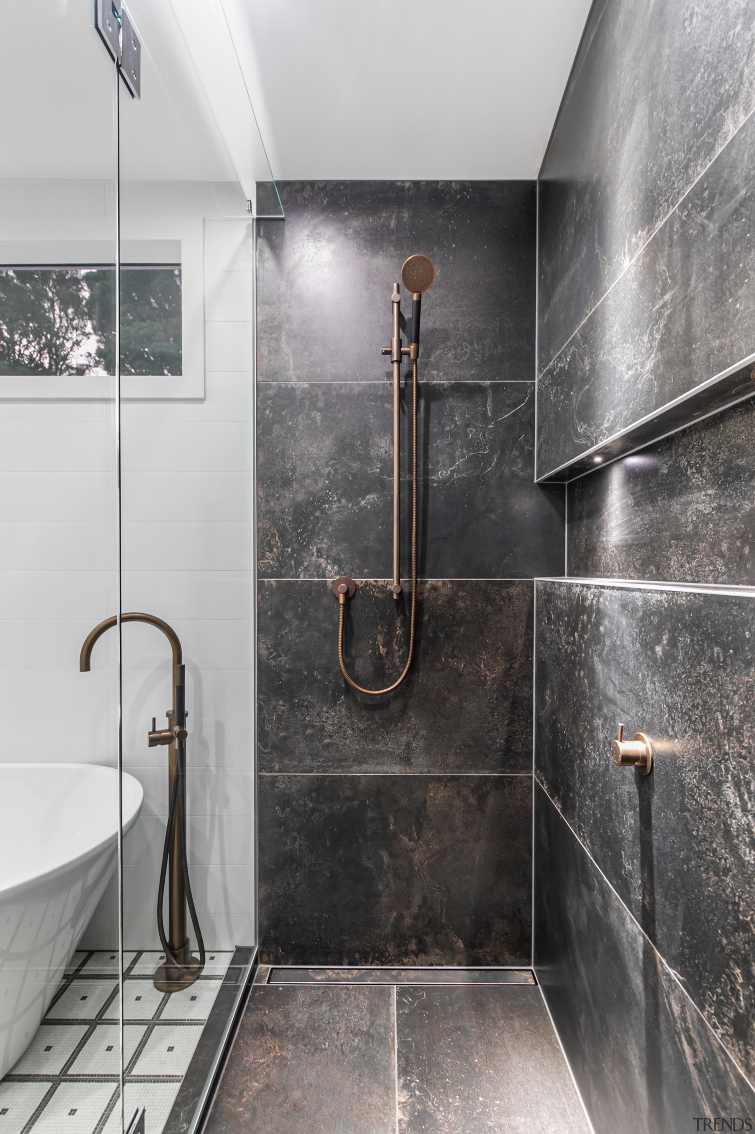 The shower stall from within – tall, dark, 