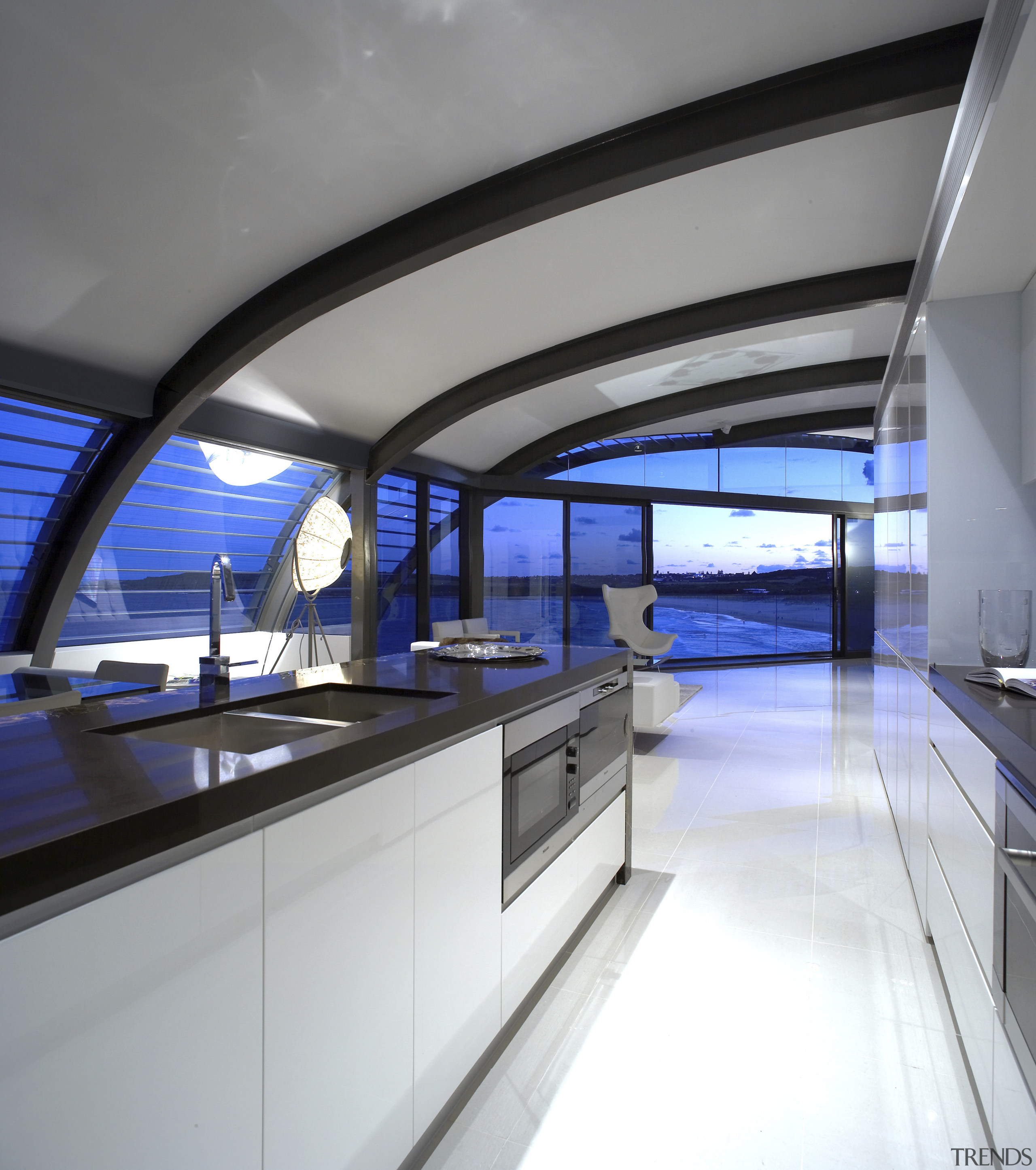 View of an apartment kitchen which features an boat, daylighting, interior design, yacht, gray, white