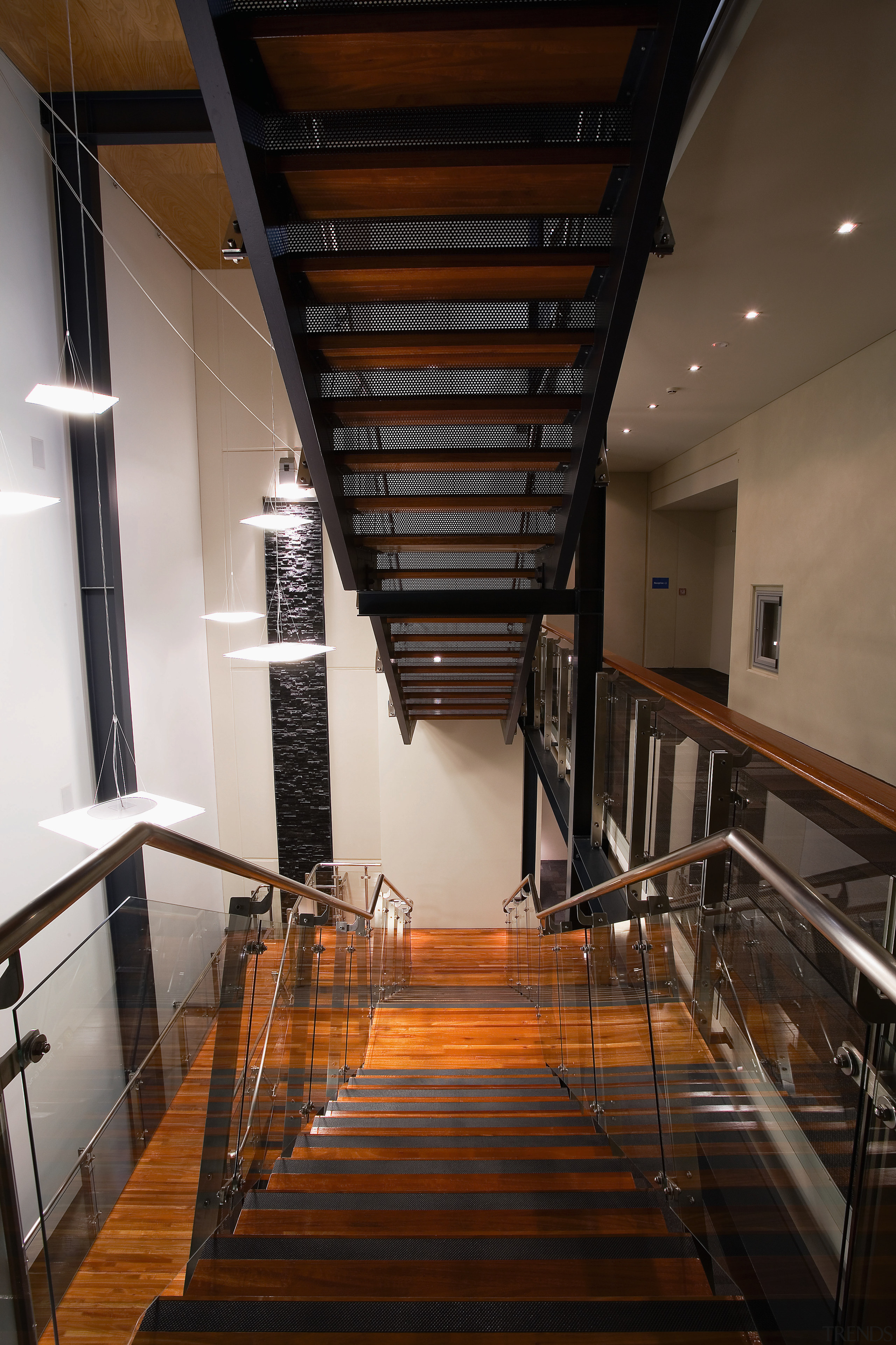 A view of the Trends Building. - A apartment, architecture, ceiling, daylighting, handrail, interior design, stairs, wood, black, brown