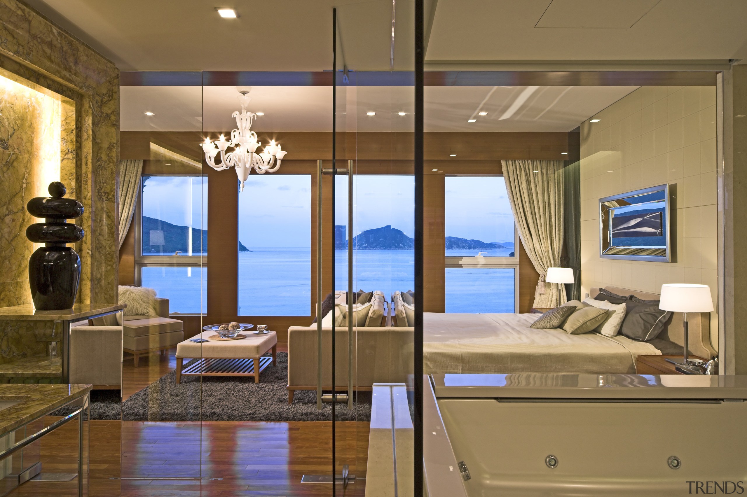 Master suite in a Hong Kong waterside apartment.Featuring ceiling, interior design, room, suite, brown