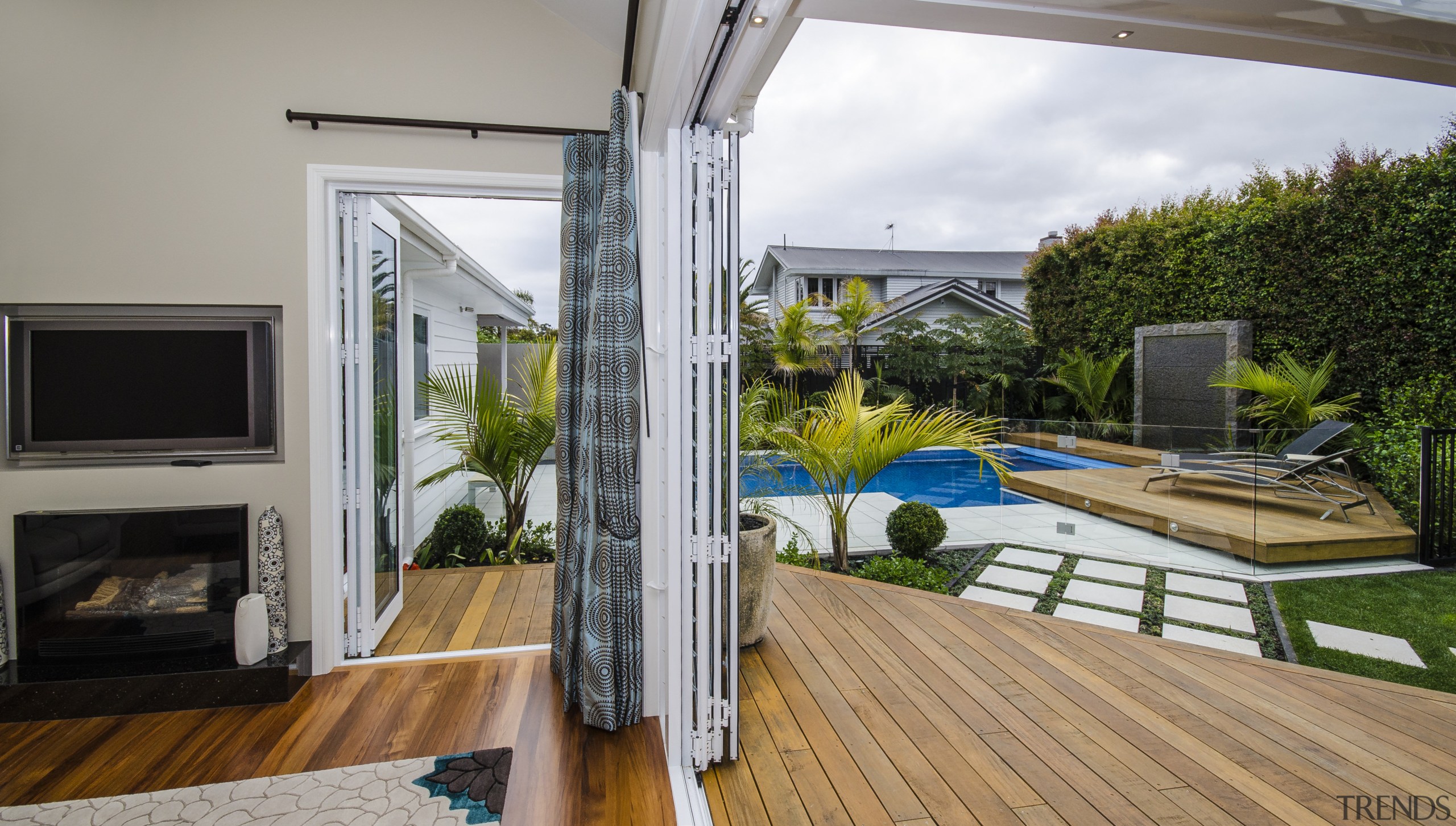 Smooth-running bifolds from Fairview Systems open up these backyard, balcony, daylighting, deck, house, interior design, property, real estate, window, gray