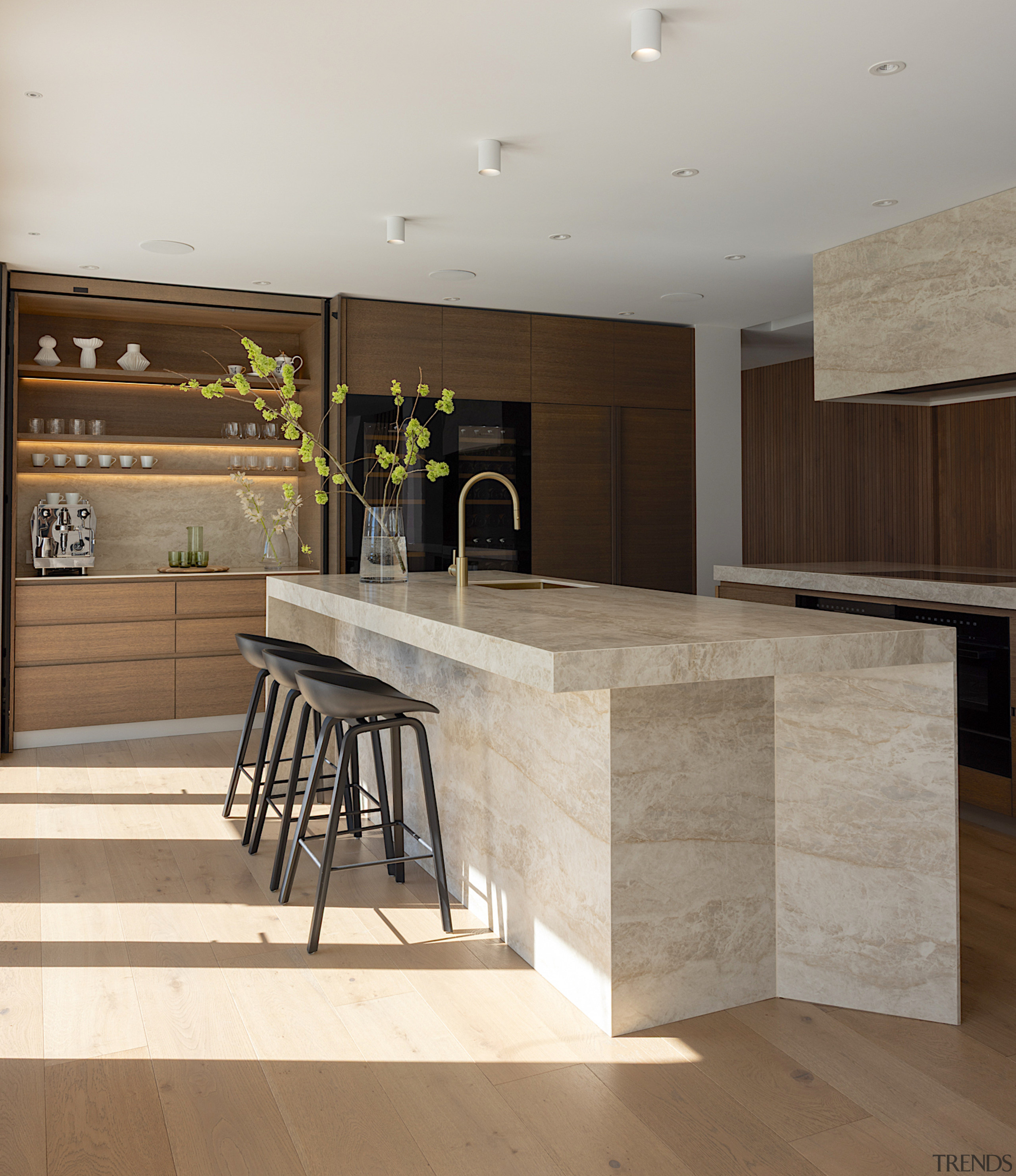 The front-of-house stone-clad island has a sculptural presence 