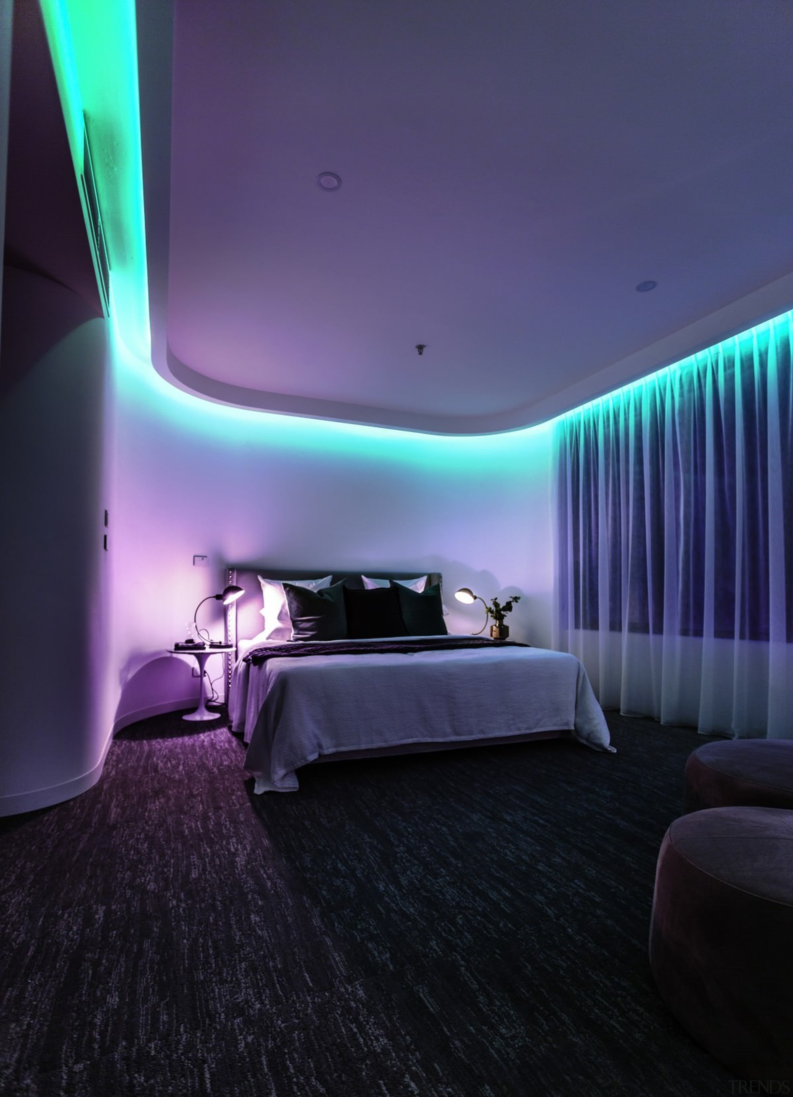 Considering the apartment was originally built in the architecture, ceiling, hotel, interior design, light, lighting, purple, room, suite, wall, black, blue