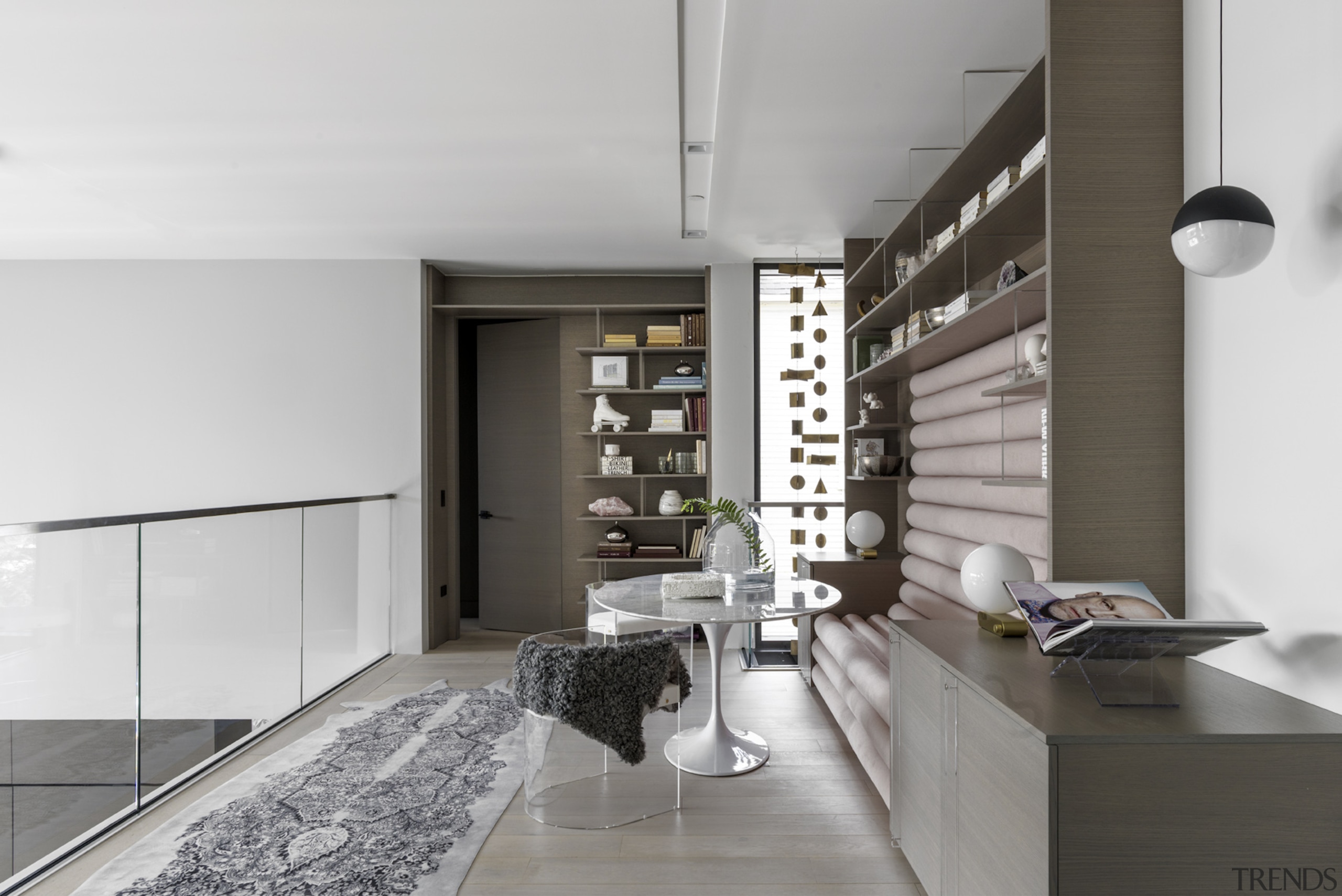 An art-infused mezzanine level in the double height 