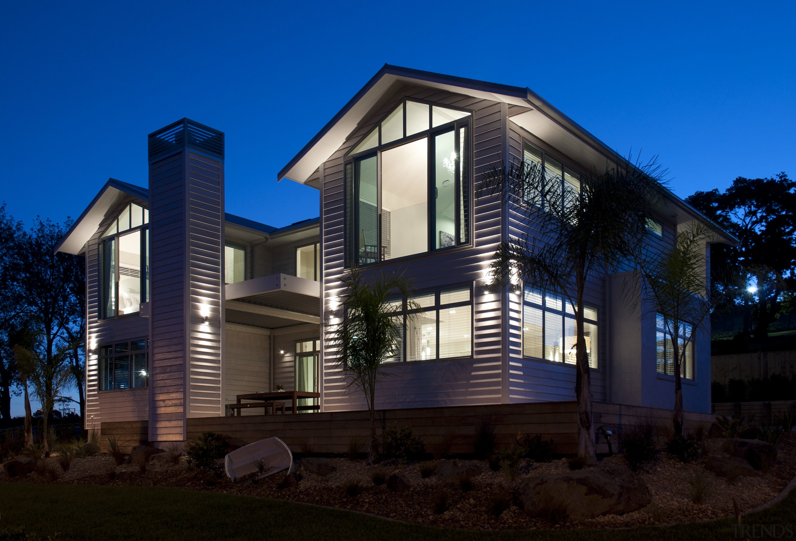 View of the Boathouse, designed to be reminiscent apartment, architecture, building, corporate headquarters, cottage, elevation, estate, facade, home, house, lighting, mixed use, property, real estate, residential area, siding, sky, window, blue, black