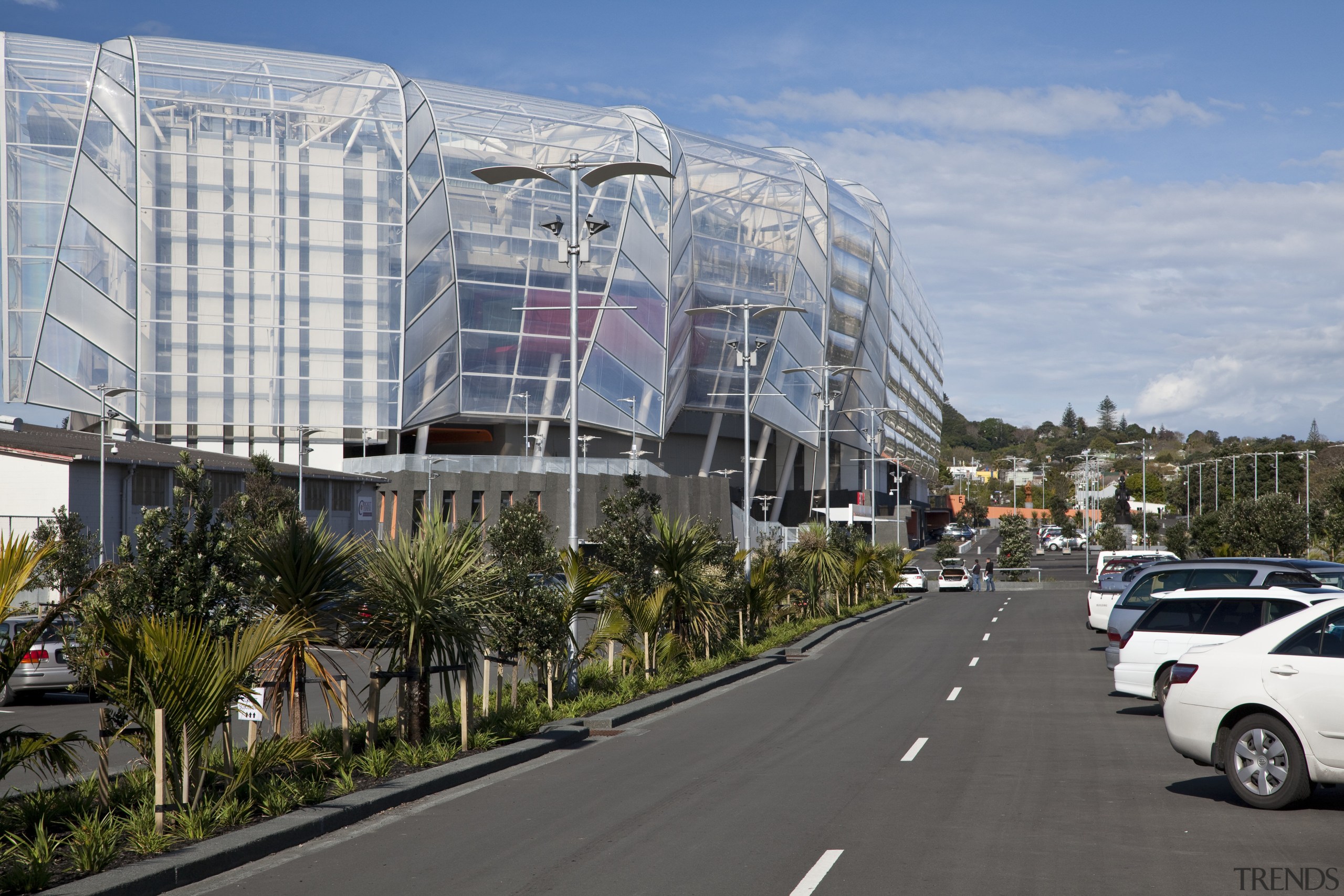 Exterior view of the newly upgraded Eden Park building, car, city, corporate headquarters, daytime, downtown, infrastructure, metropolis, metropolitan area, mixed use, neighbourhood, plaza, real estate, residential area, road, sky, transport, urban area, gray