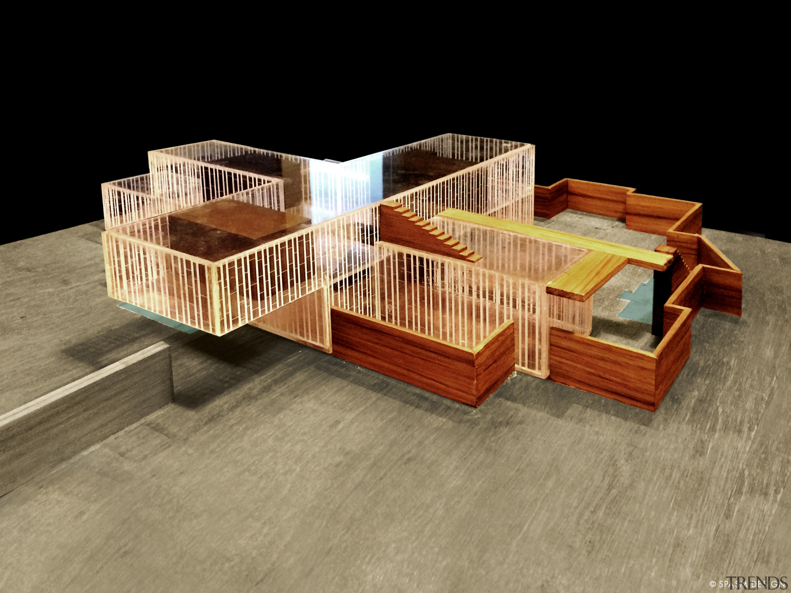 A model of the cross-shaped home indicates the architecture, floor, hardwood, house, product, scale model, wood, brown, black