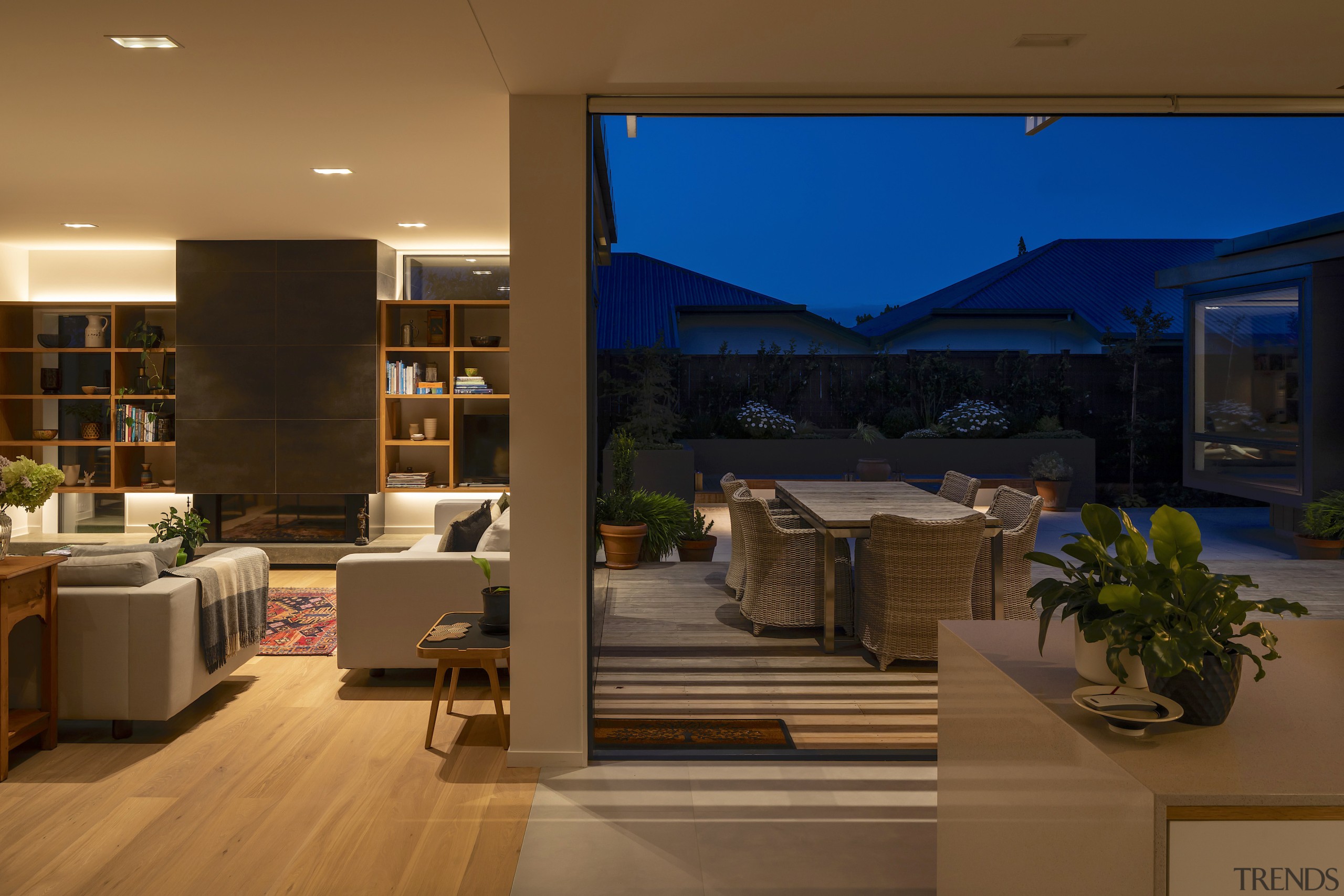 The main courtyard and living room as dusk 