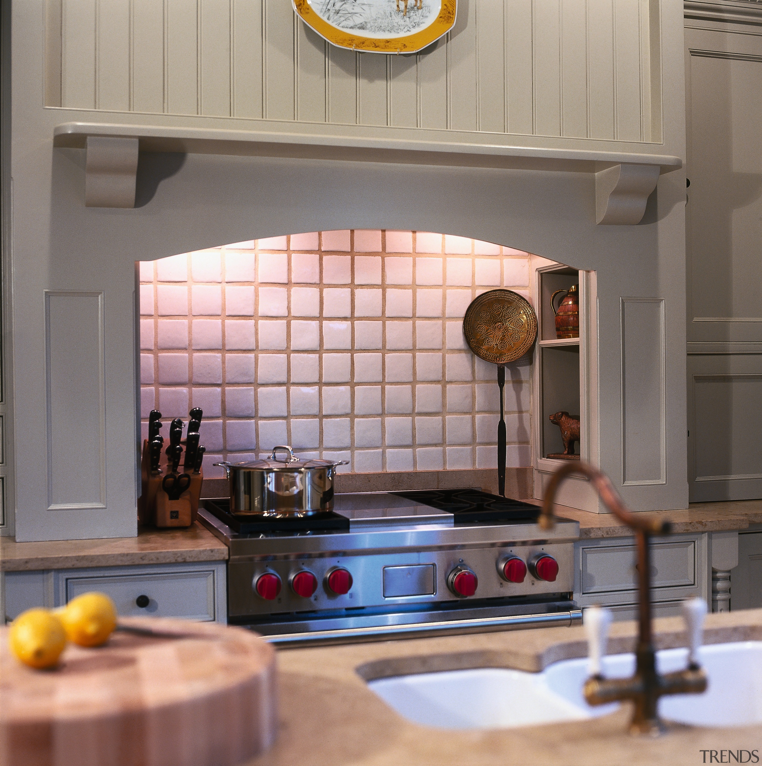 A view of this kitchen that features a countertop, floor, flooring, interior design, kitchen, room, gray