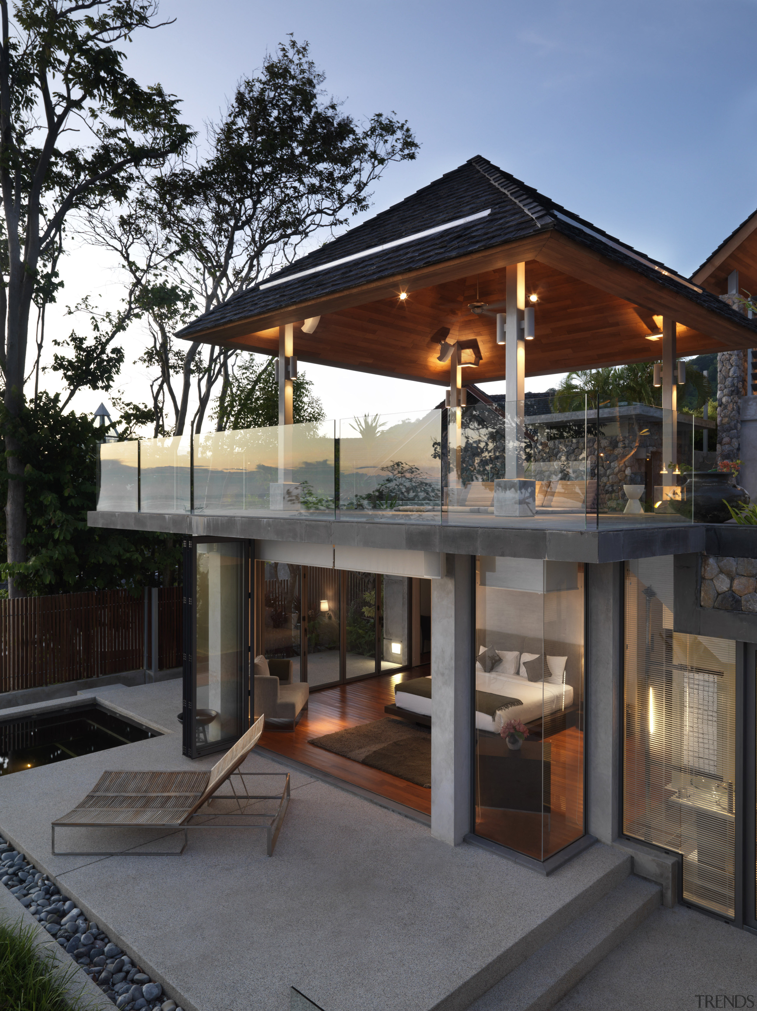 This house is located above a rocky outcrop architecture, house, outdoor structure, black, gray