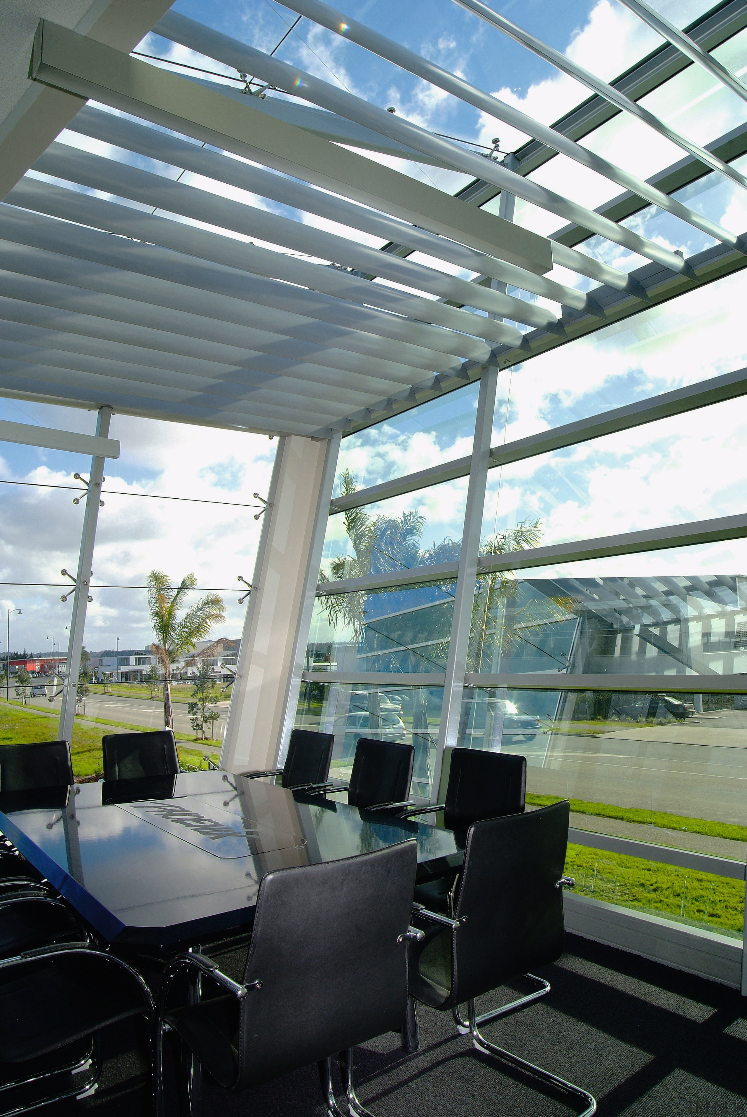 View of boardroom with table and chairs, and architecture, daylighting, glass, interior design, roof, window, gray