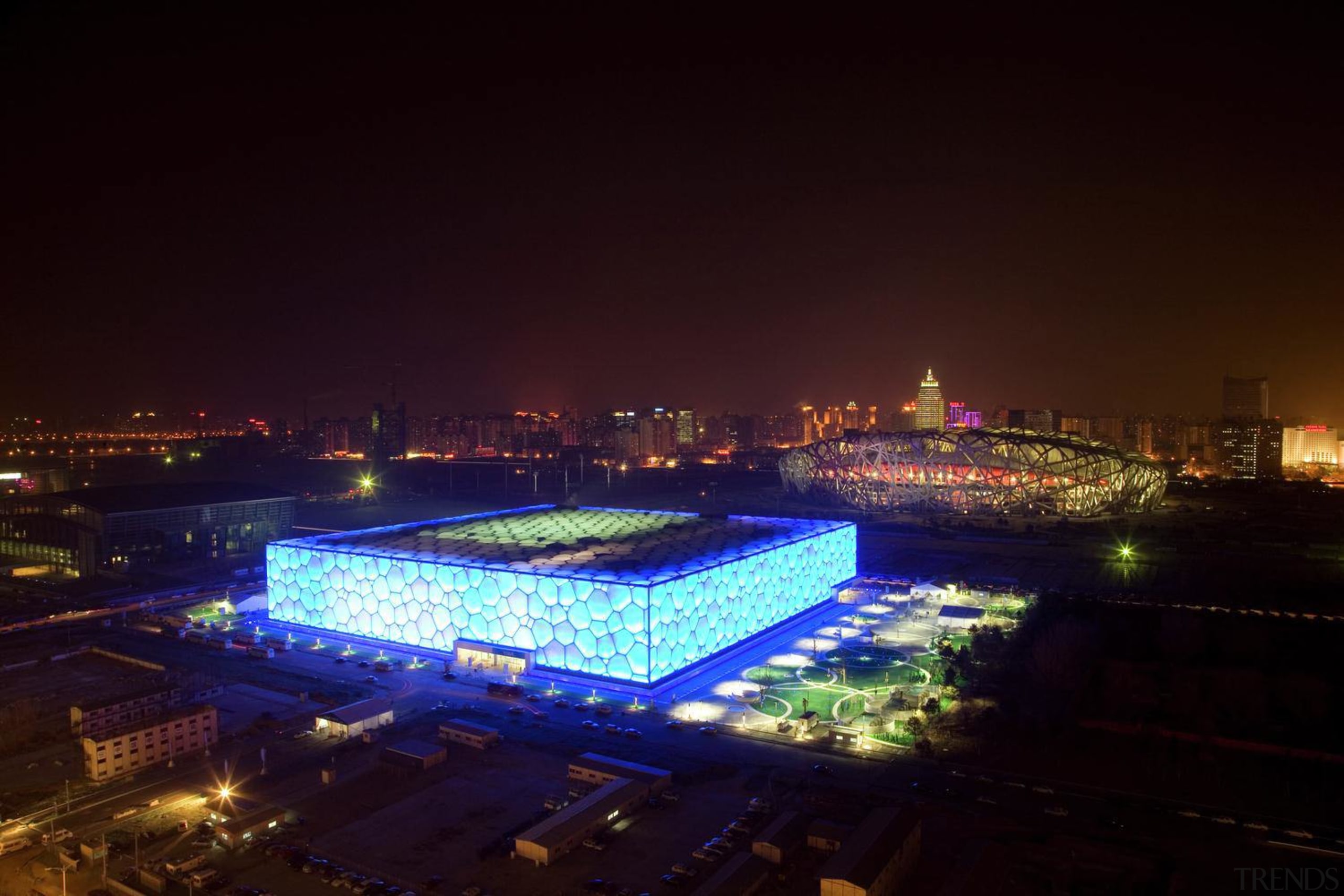 The 70,000 m² National Aquatics Center in Beijing architecture, city, cityscape, downtown, landmark, metropolis, metropolitan area, night, sky, skyline, sport venue, structure, tourist attraction, urban area, black