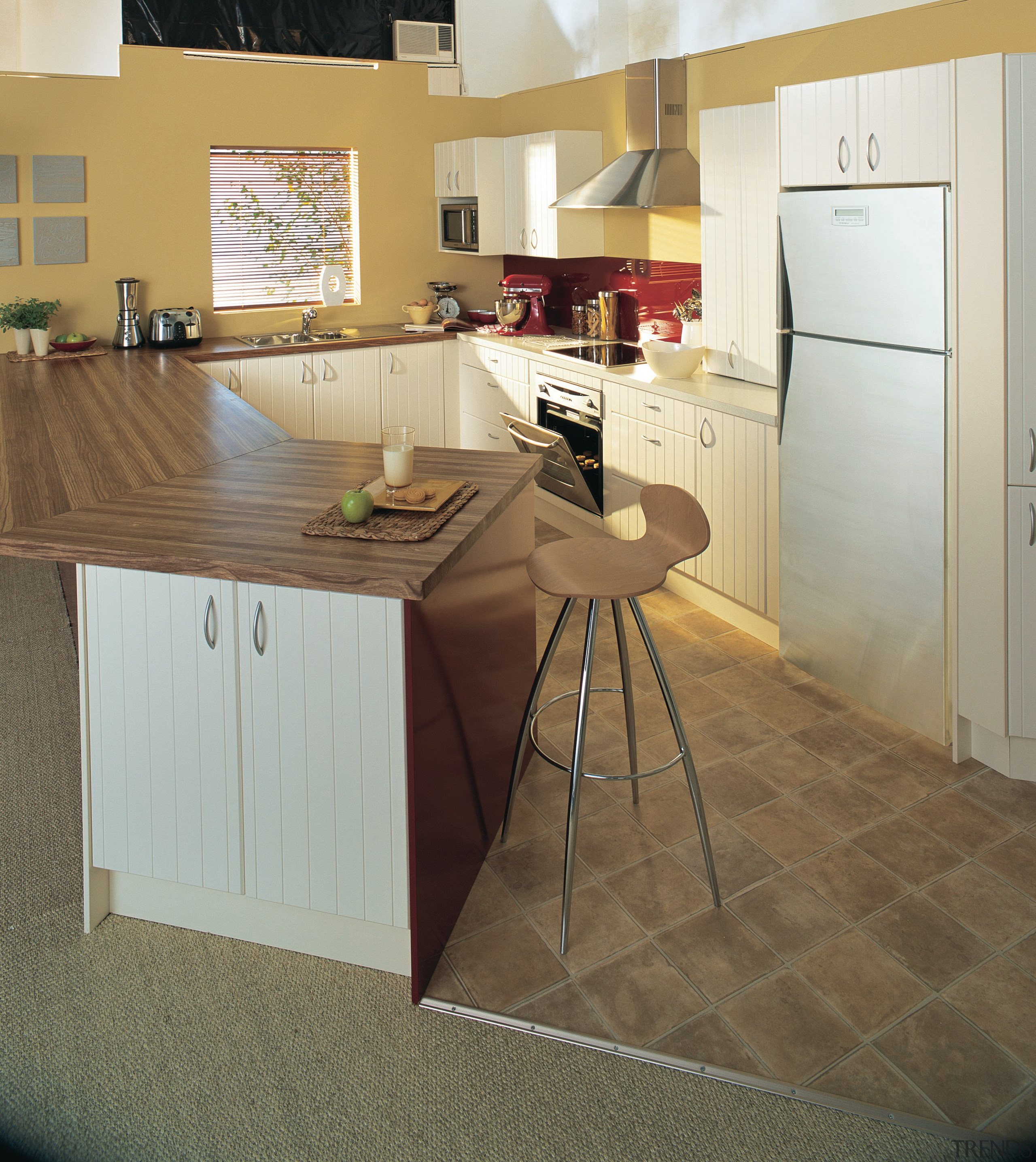 Showroom kitchen with solid wood benchtop, white cabinetry, cabinetry, countertop, cuisine classique, floor, flooring, furniture, hardwood, interior design, kitchen, laminate flooring, product design, room, table, tile, wood, wood flooring, brown, green