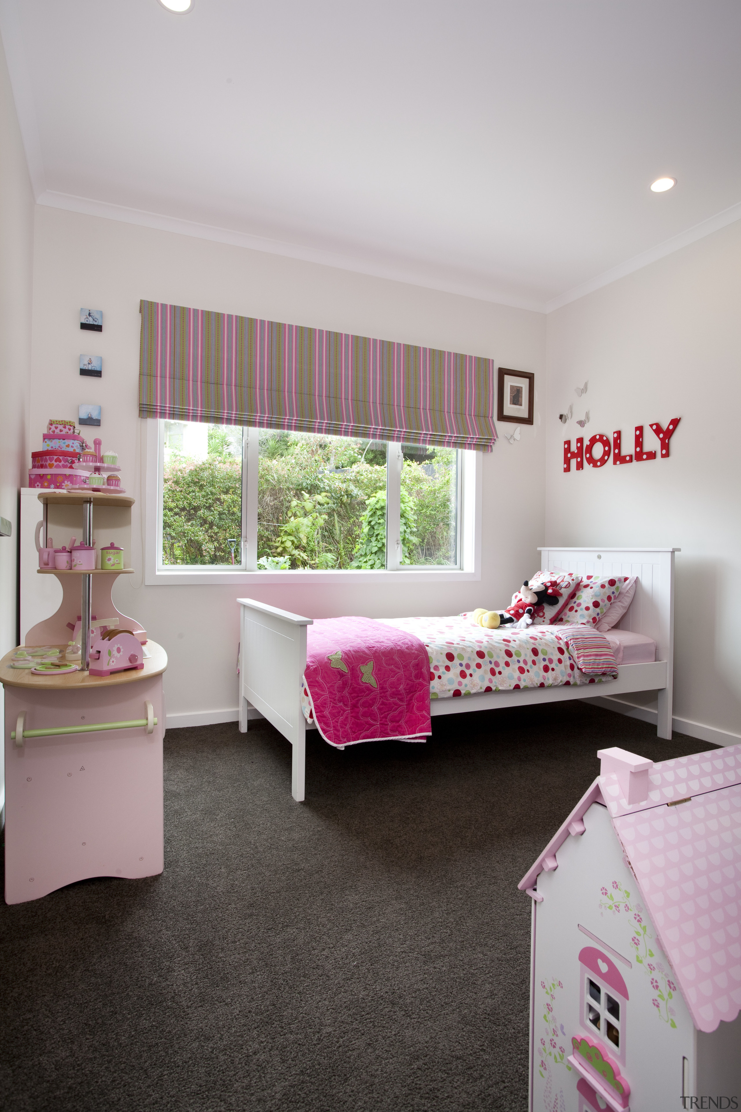 Child's room with grey carpet, pink bedding and bed, bed frame, bed sheet, bedding, bedroom, ceiling, furniture, home, interior design, pink, product, real estate, room, textile, gray