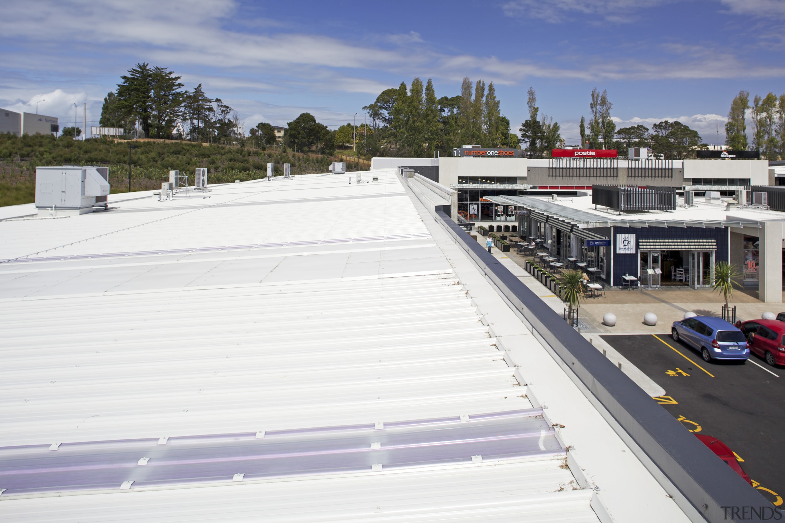 The Silverdale Centre roof was installed by Kiwi real estate, roof, structure, white