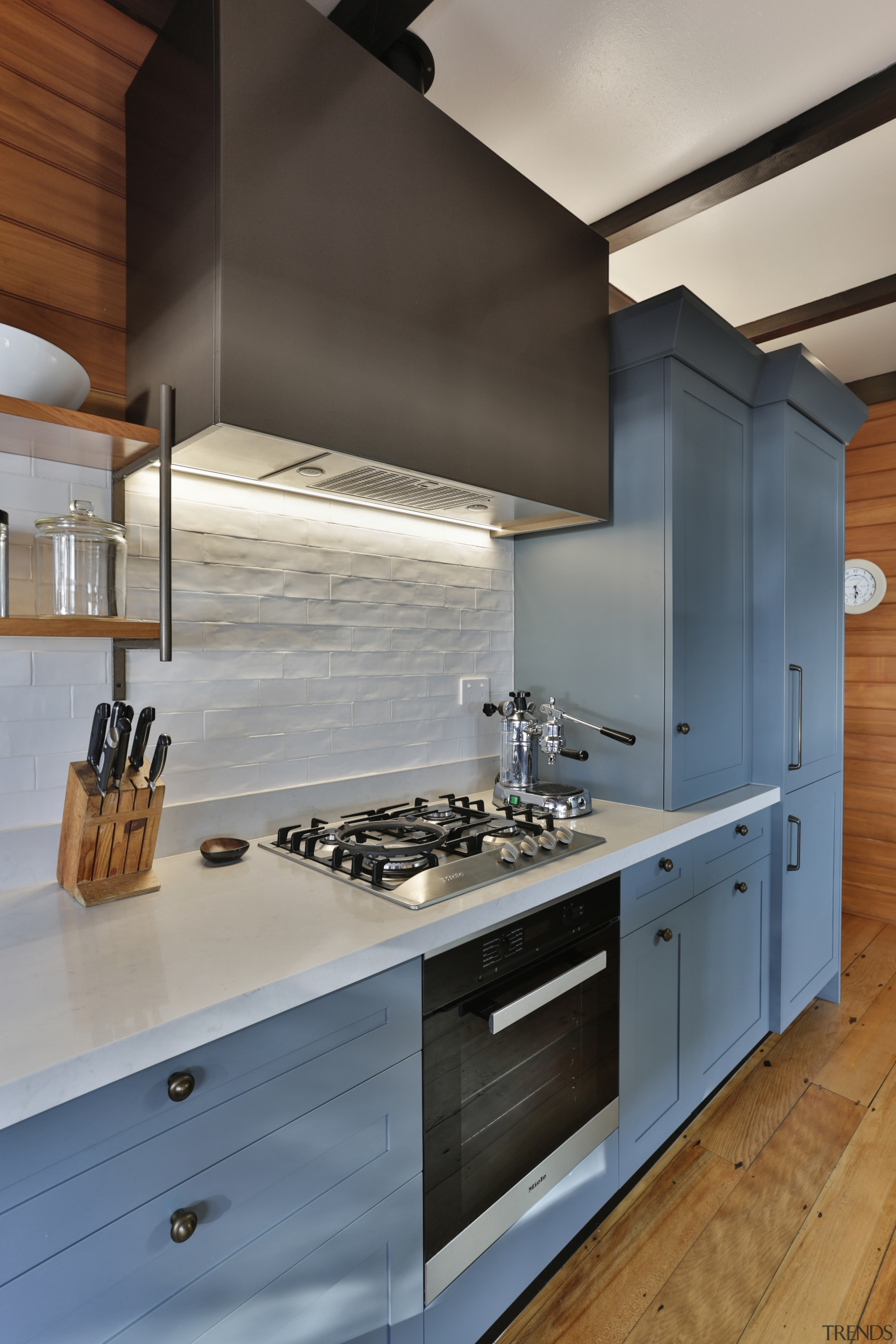 This kitchen is well set up for few architecture, building, cabinetry, ceiling, countertop, cuisine classique, design, drawer, exhaust hood, floor, flooring, furniture, hardwood, home, house, interior design, kitchen, kitchen stove, material property, property, real estate, room, tile, wood, wood flooring, wood stain, gray