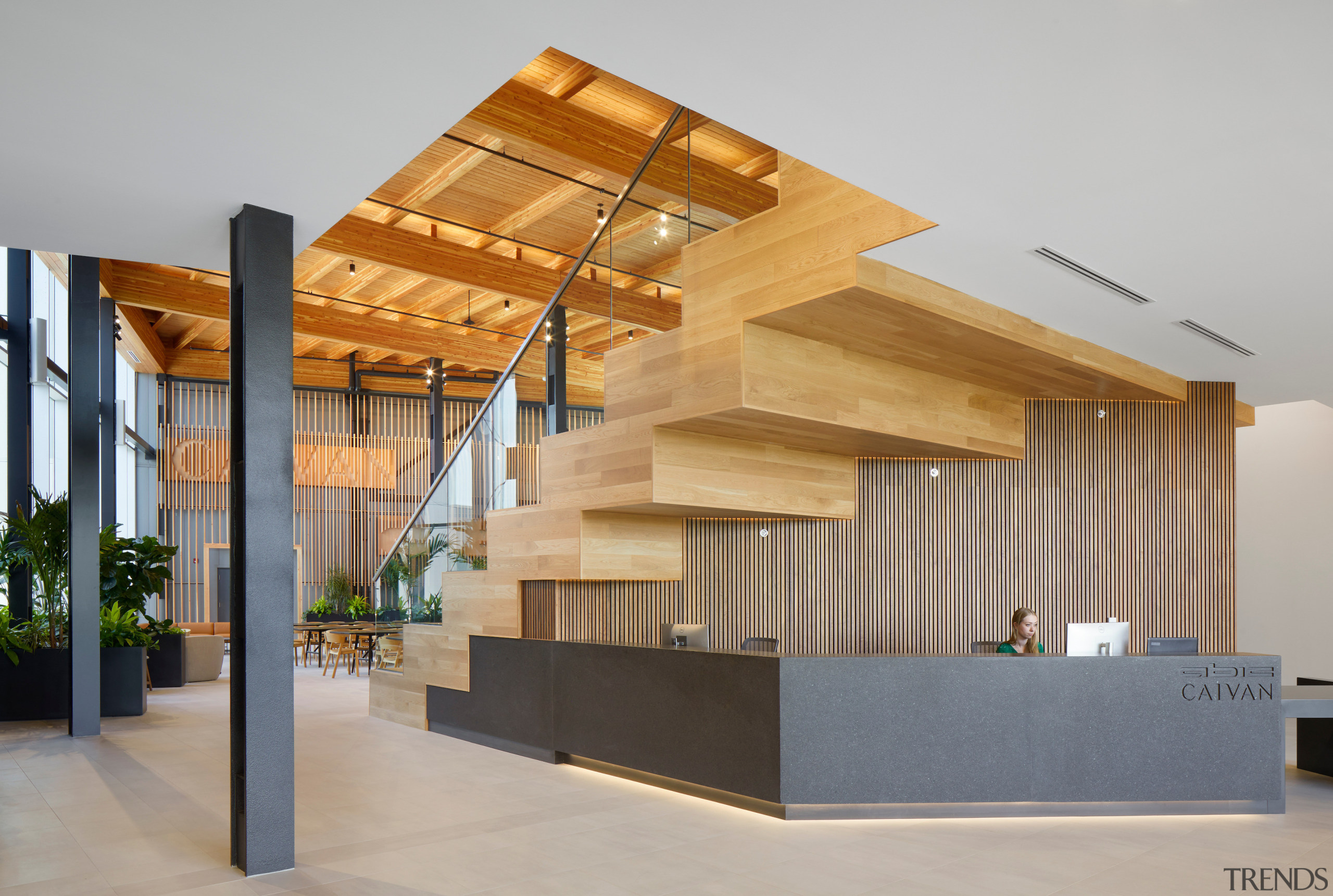 Reception overshadowed by giant stair. - Redefining the 