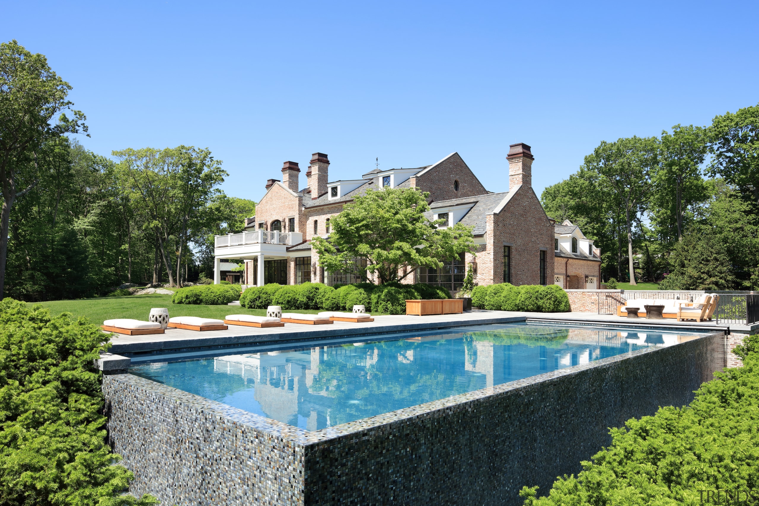 The clean-lined pool has a mosaic tile exterior 