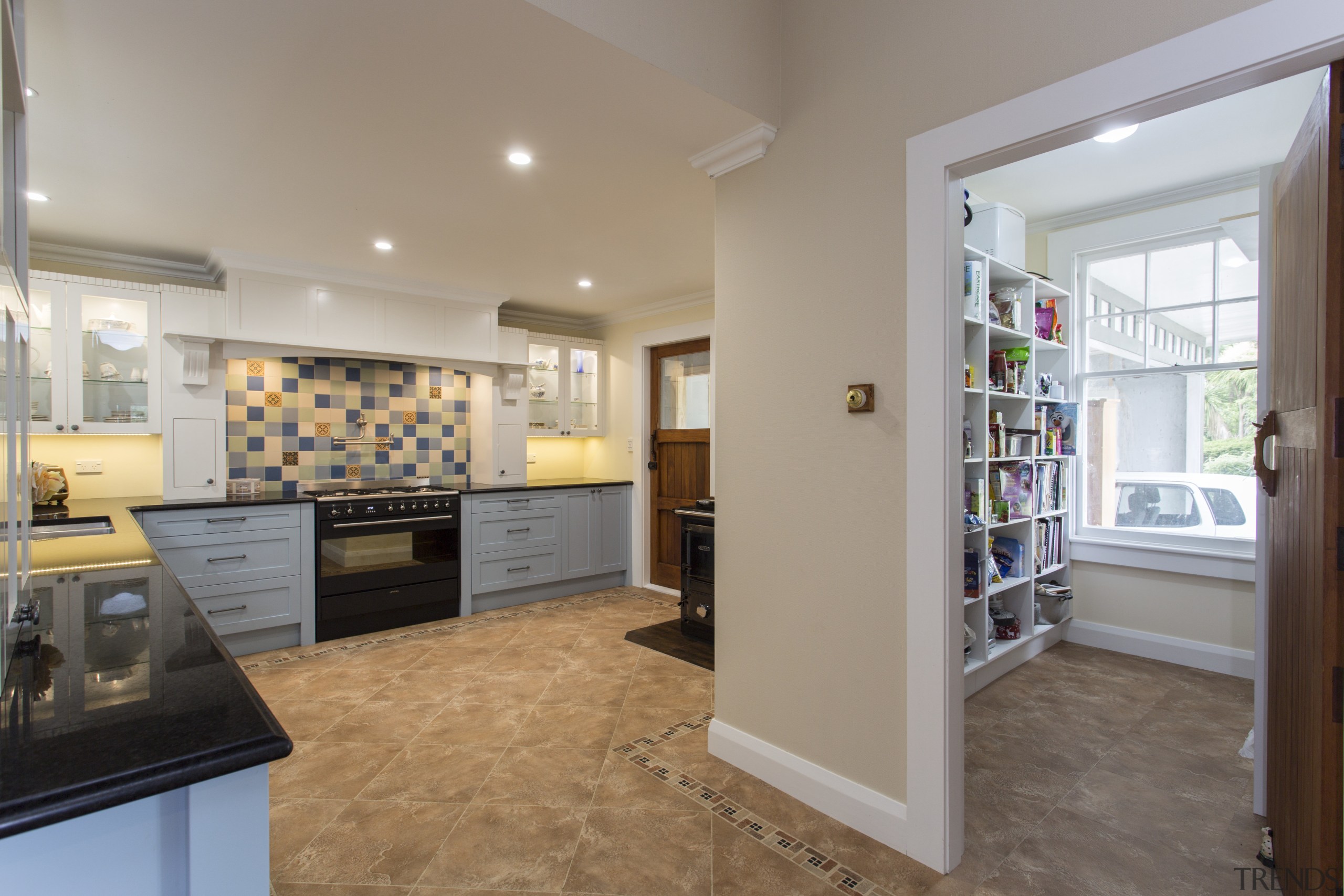 The subtle paint colours in this kitchen by floor, flooring, home, interior design, kitchen, property, real estate, room, gray