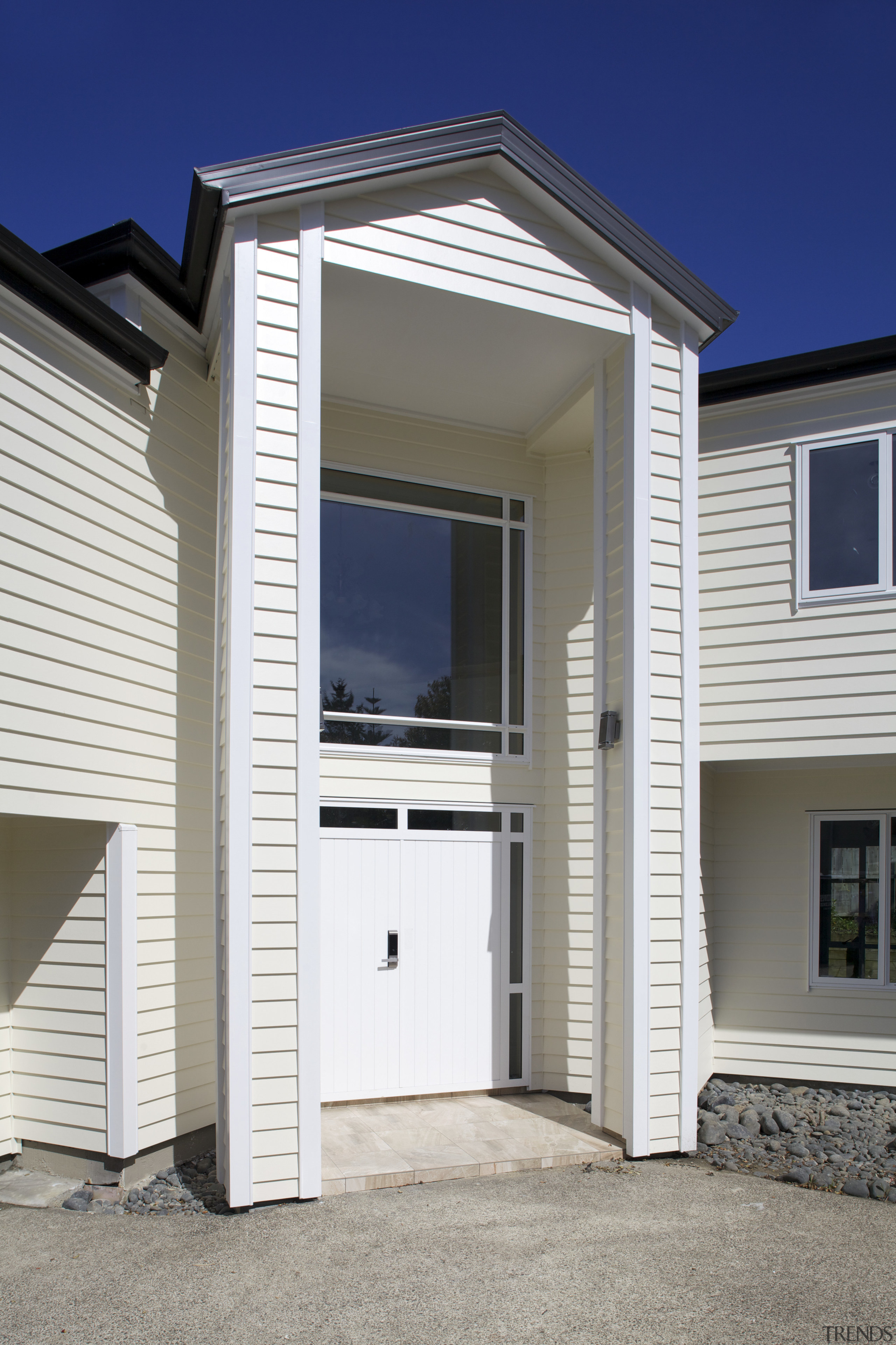 Namu Construction remodelled this expansive home with James building, door, elevation, facade, home, house, property, real estate, residential area, siding, window, white, gray