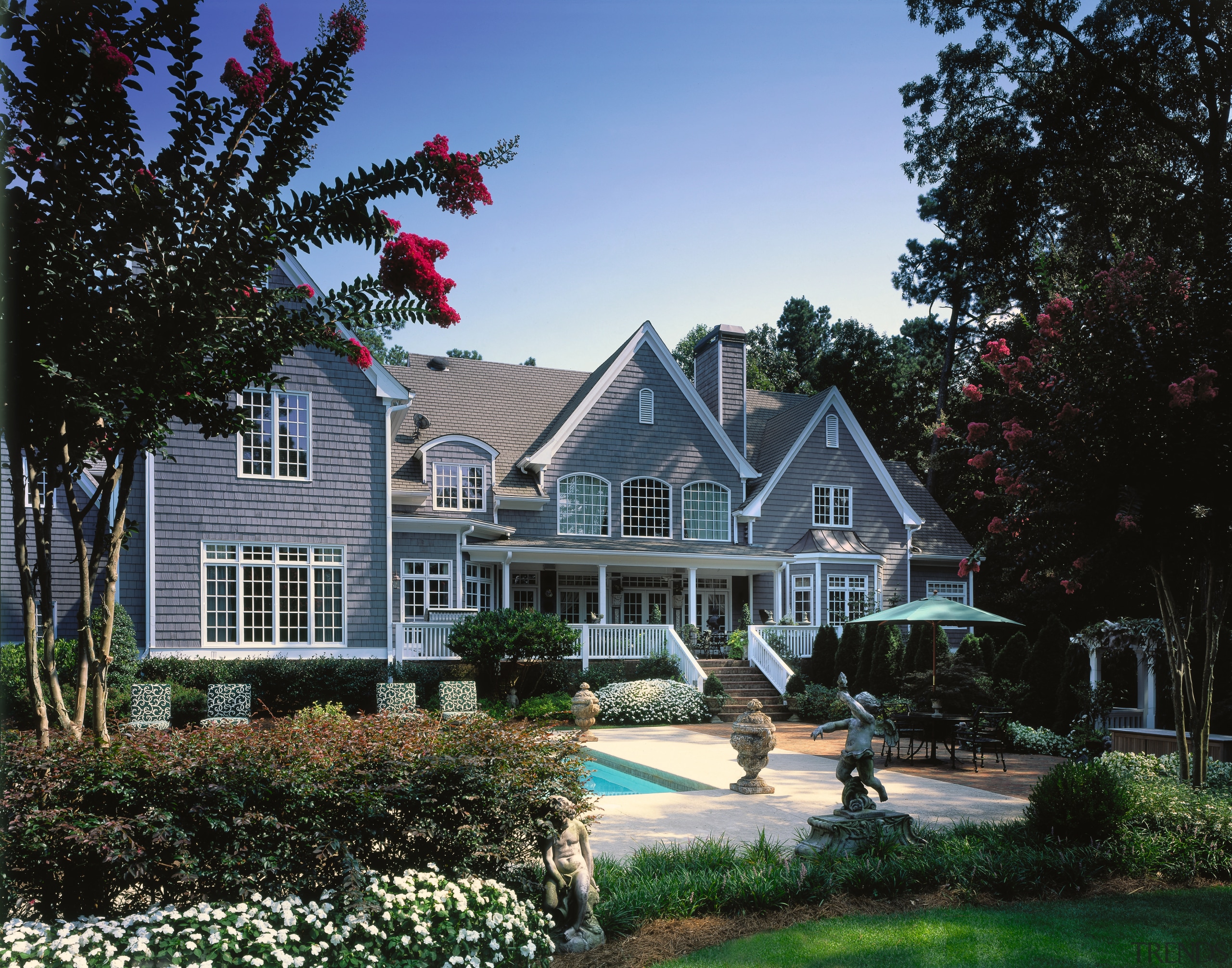 An exterior view of the entire pool and cottage, estate, farmhouse, historic house, home, house, landscape, landscaping, mansion, neighbourhood, outdoor structure, plant, property, real estate, residential area, roof, siding, suburb, tree, window, black