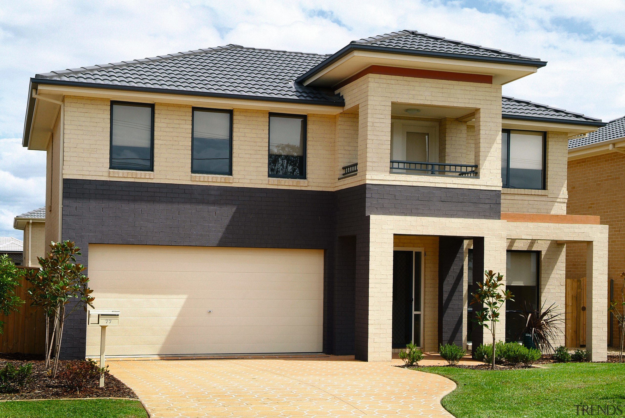 A vieew of Dark Vertical Bands of colourbrick building, elevation, estate, facade, home, house, property, real estate, residential area, roof, siding, window, orange