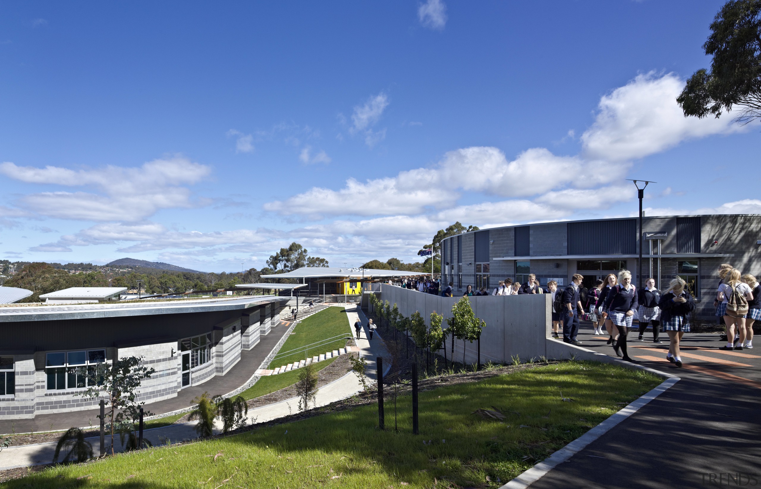 View of exterior with landscaping. - View of architecture, city, corporate headquarters, mixed use, real estate, sky, sport venue, structure, tree, teal