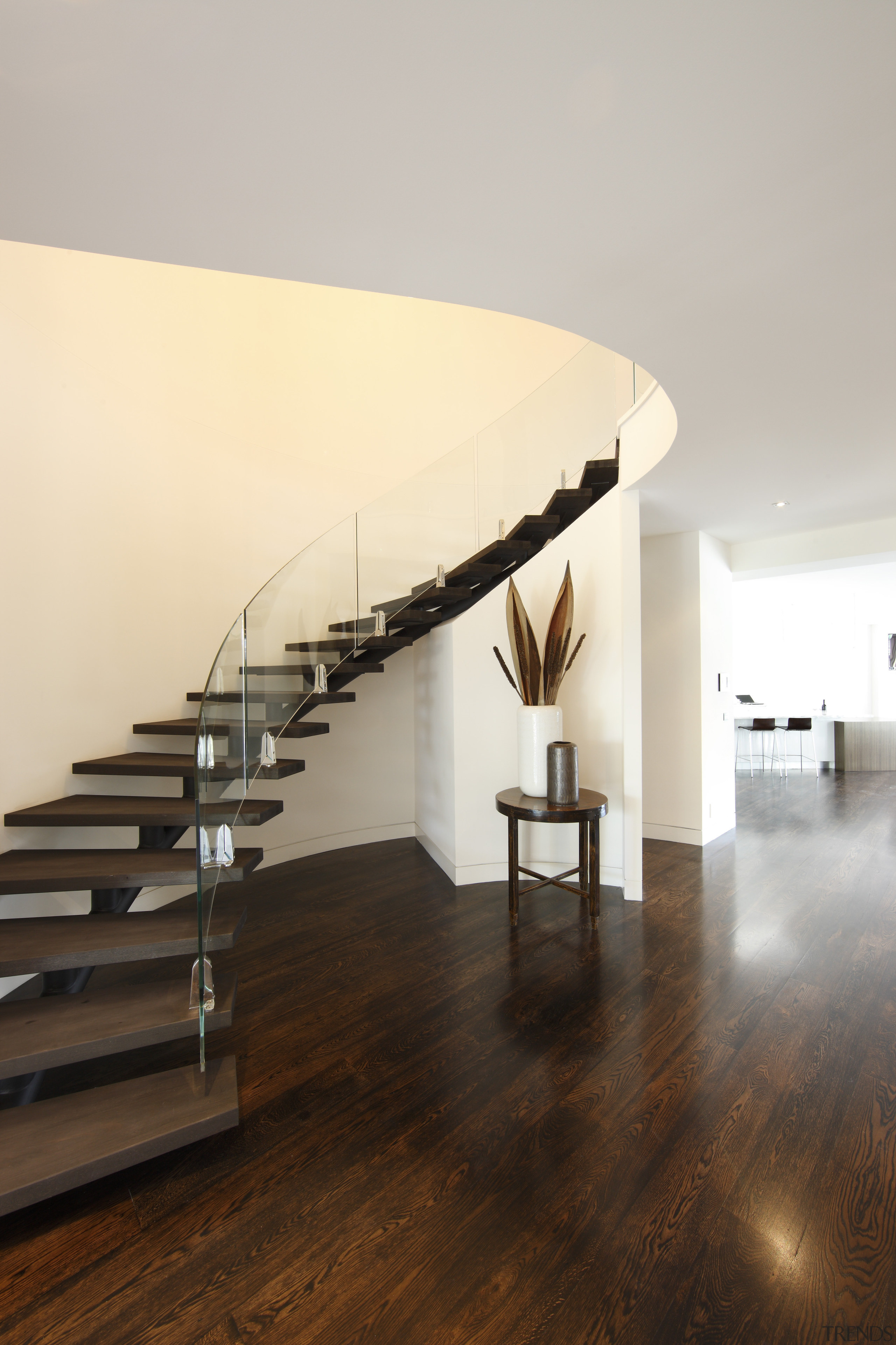 View of a stairway which features a curved ceiling, floor, flooring, handrail, hardwood, interior design, laminate flooring, product design, stairs, wood, wood flooring, white, brown