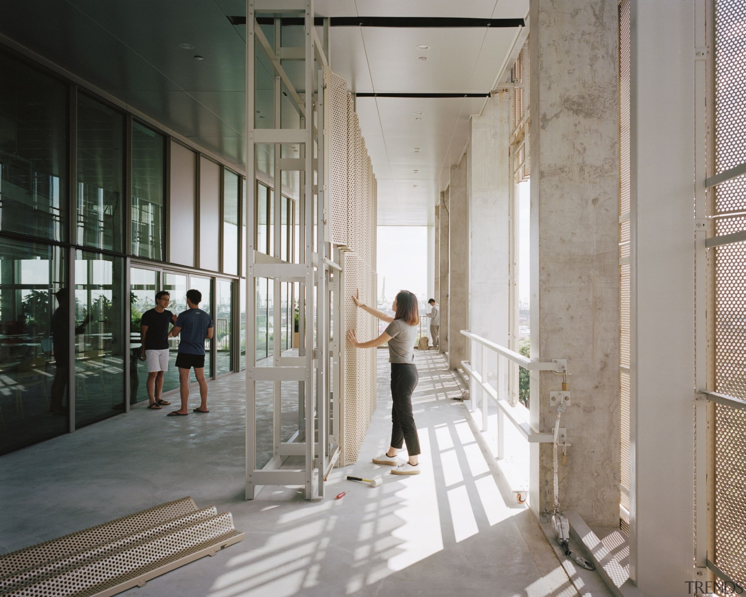 A student manipulates the moveable and replaceable aluminium architecture, building, ceiling, column, moveable facade systems,  SDE4 building